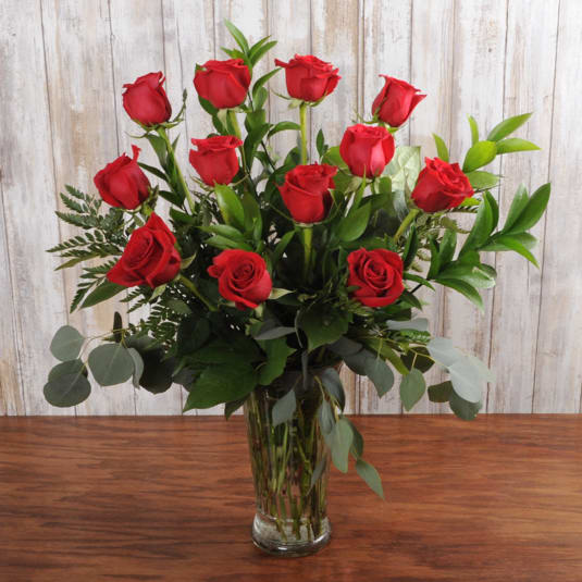 The Perfect Dozen - A dozen red roses are always perfect, always savored. We add even more charming beauty with seeded eucalyptus, spiral eucalyptus and salal.