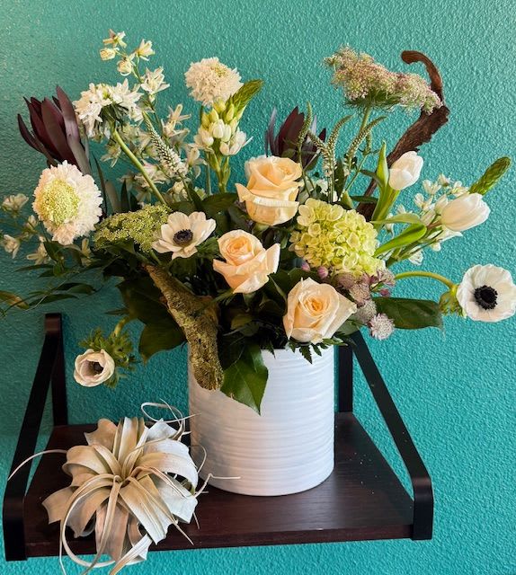 Luxe Blanc  - A sophisticated all-white arrangement featuring premium blooms in a sleek, modern design. Elegant textures and refined composition create a timeless statement of luxury and purity. Approximate size: 12" x 16".