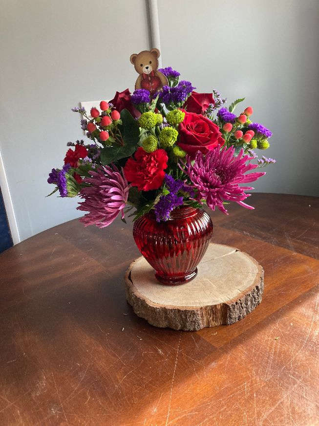 beary sweet - lovely red vase arrangement perfect for your sweetheart with red roses, red carnations, purple fugi, purple statice and more .... and a very adorable bear pic 