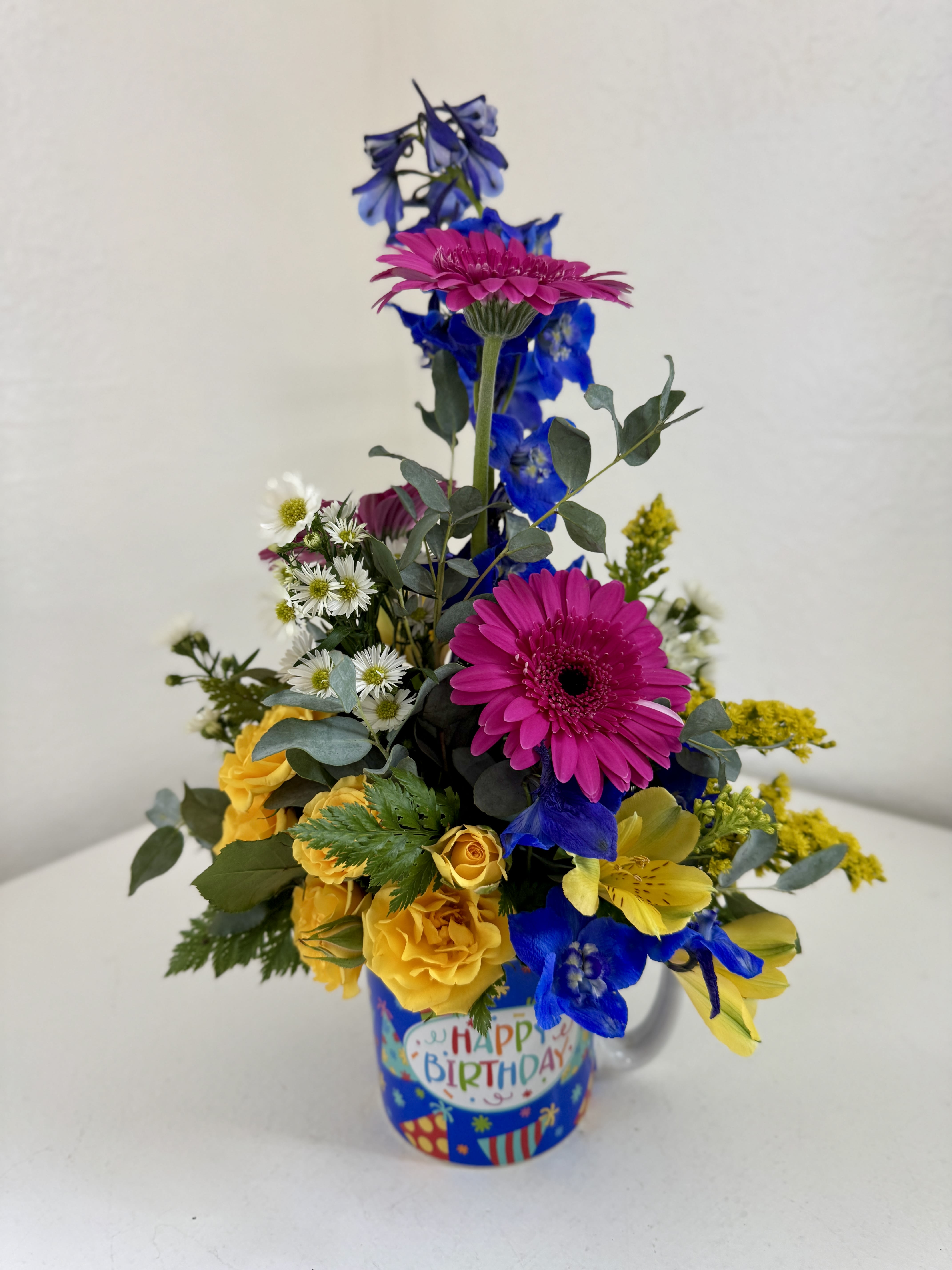Happy Birthday Mug - A unisex reusable mug with "Happy Birthday" written on both sides filled with gorgeous blooms! Please indicate if you'd like a certain color palate otherwise we will make it similar to the picture provided.
