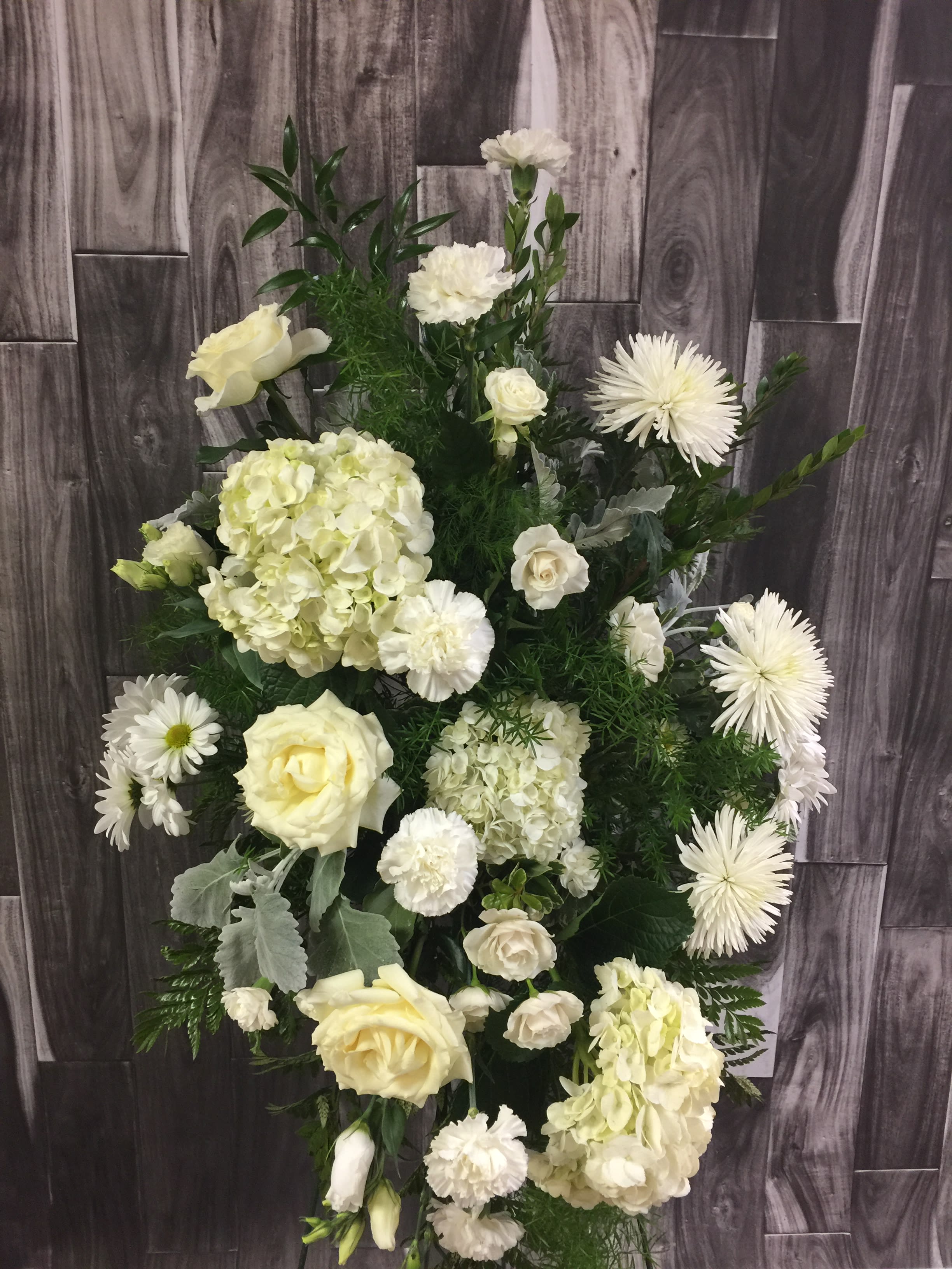 Heavenly Spray - Express your feelings with this lovely white spray of flowers including hydrangea, roses, spider mums and carnations.
