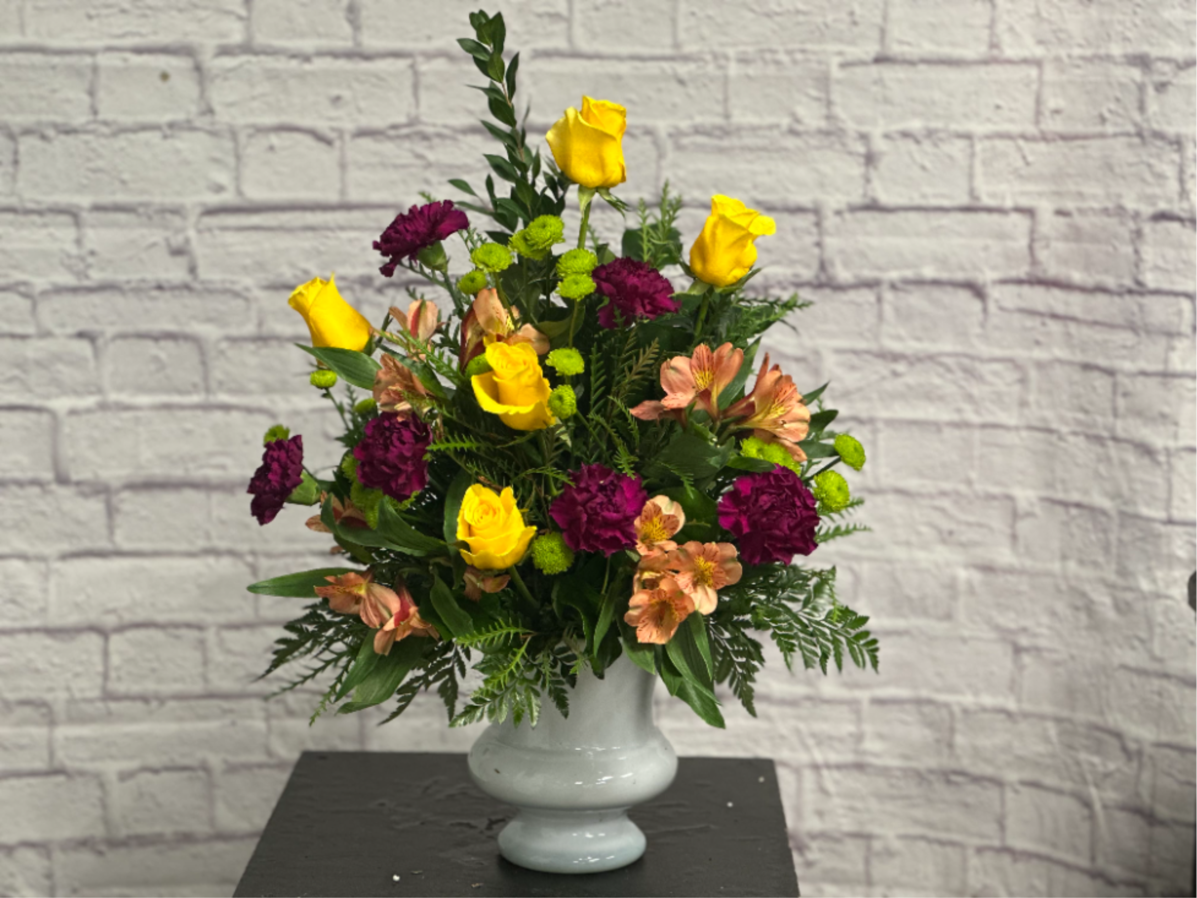 Colorful Sympathy Tribute - Bright colors in this traditional arrangement is a perfect way to send your condolences.