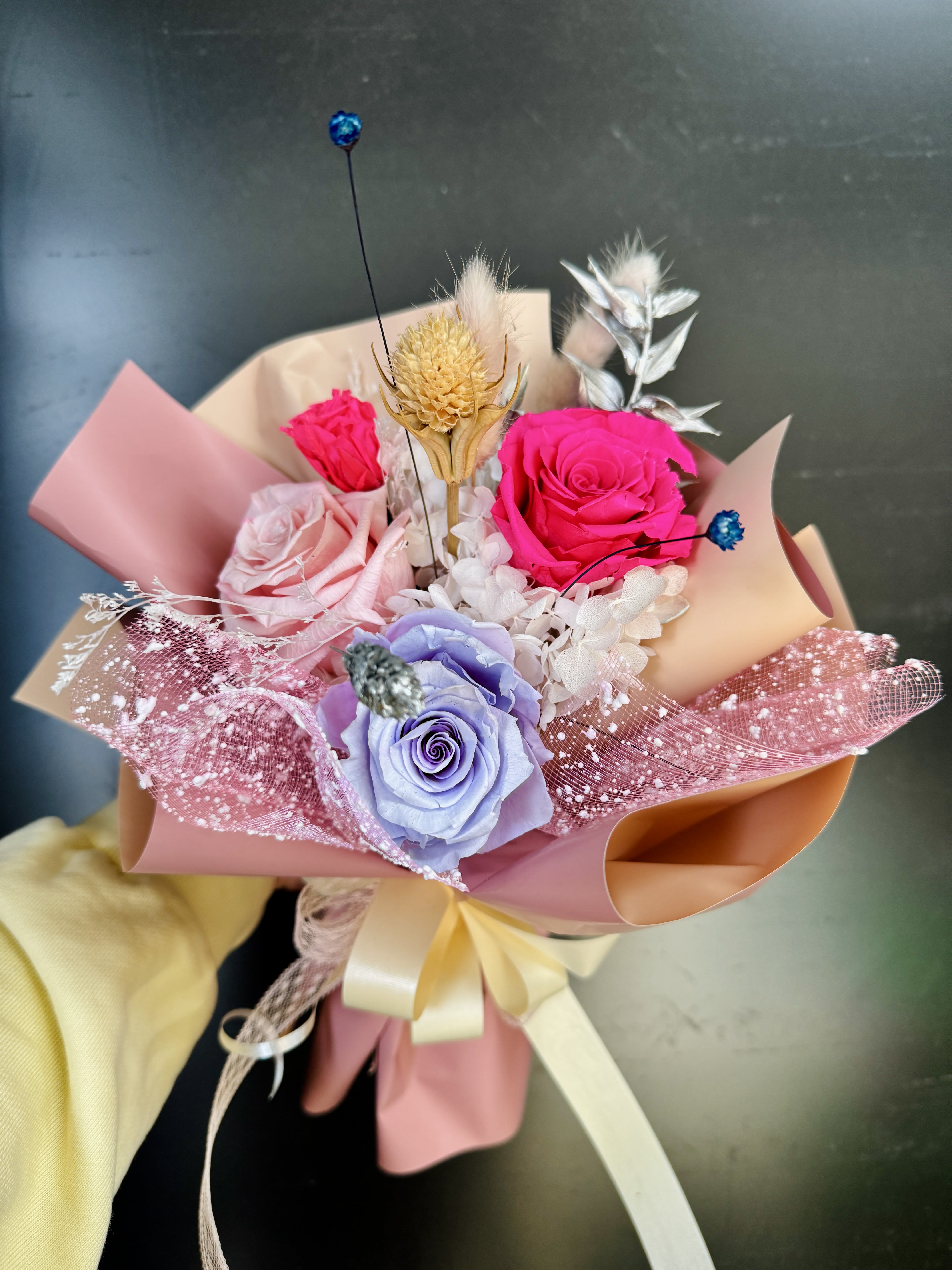 pink&amp;purple preserved rose bouquet - 4 assorted purple ,hot pink and blush preserved roses wrapped in soft peach papers