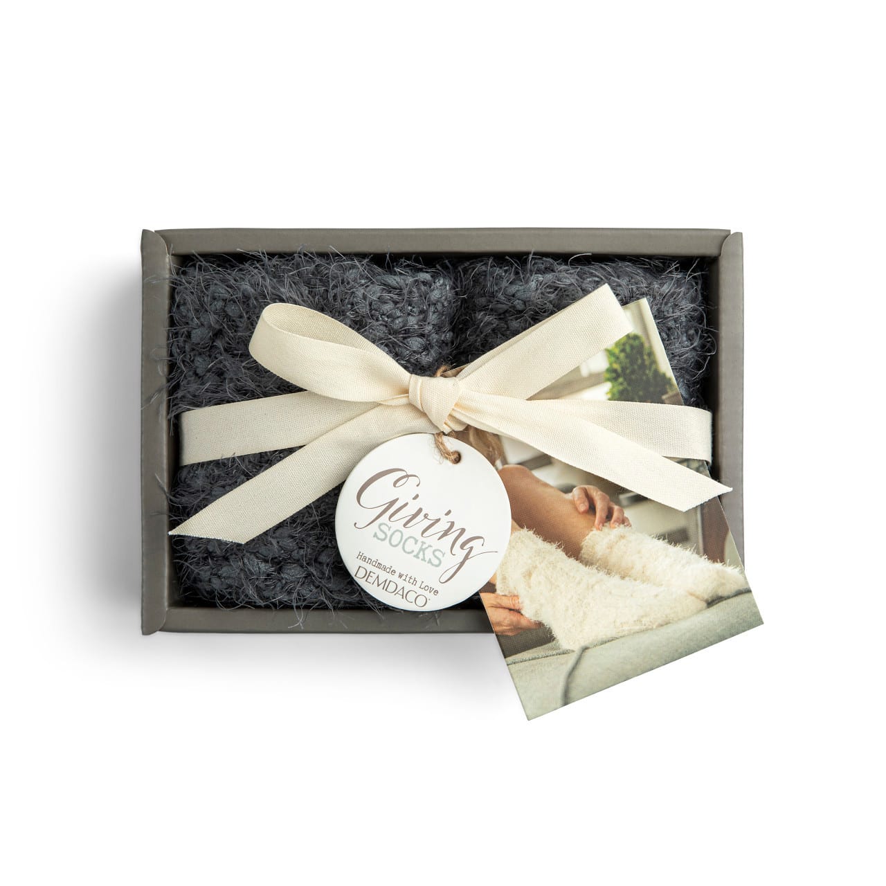 Demdaco Giving Socks - We all need a little comfort now and then... A reminder to help us know that we are not alone in the world... That someone is in our corner cheering us on no matter what. So we created the Giving Socks to be like a cozy, warm hug - any time it's needed. These socks have been knit together with love to remind you someone is always thinking of you with warm, fuzzy feelings, and a hug in their heart.