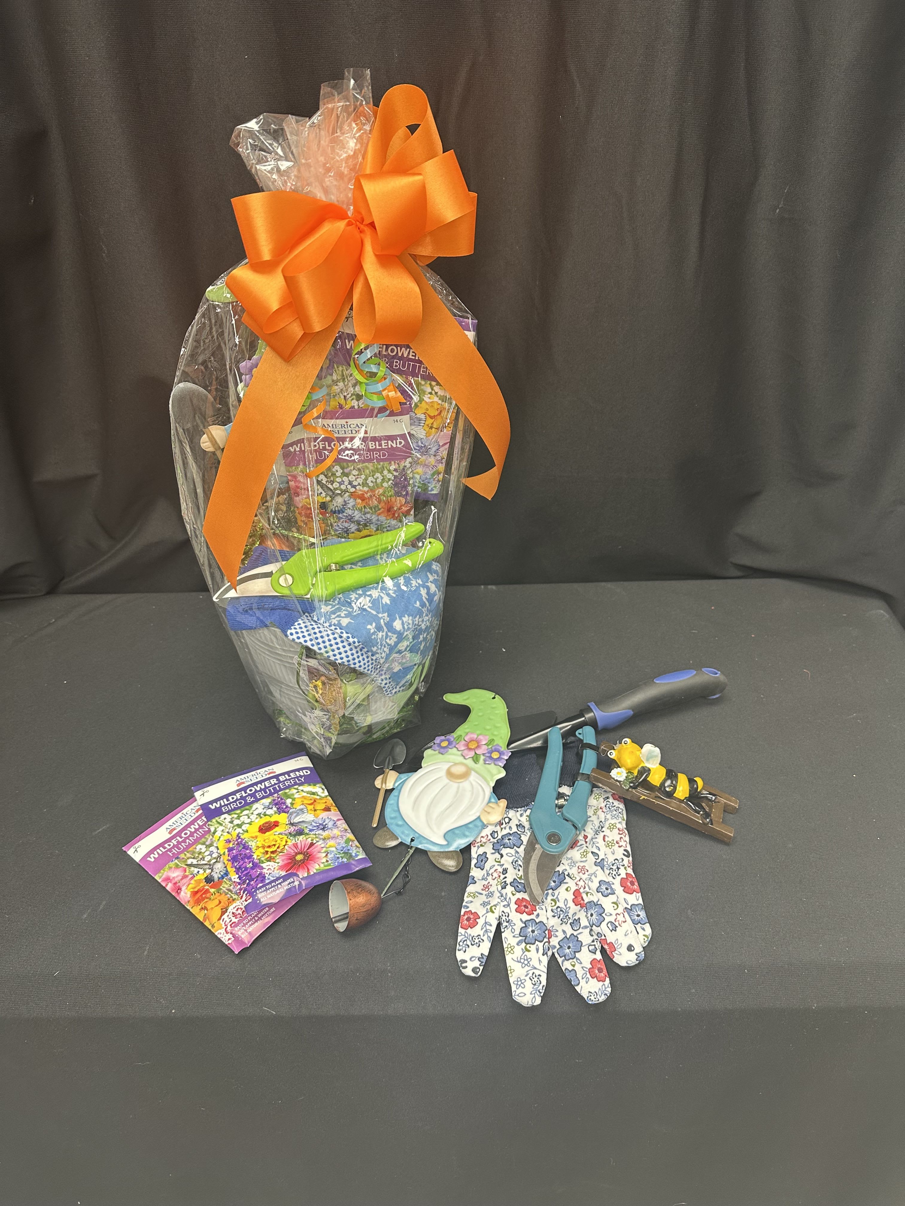 Grow Happy Basket - Bring joy to any green thumb with our Grow Happy Basket! Filled with gardening essentials like floral gloves, pruning shears, seed packets, and playful accents, this gift set is perfect for anyone who loves to dig in the dirt and watch beauty bloom. Thoughtful and fun, it’s a wonderful way to celebrate birthdays, Mother’s Day, or simply brighten someone’s day with the promise of growth and sunshine.