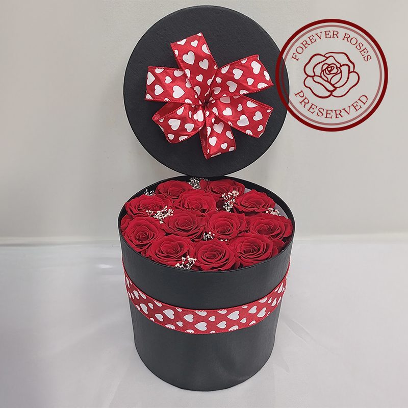 Red Secret Preserved Box - OCF - 12 preserved roses complimented with preserved baby's breath, in a black hat box.
