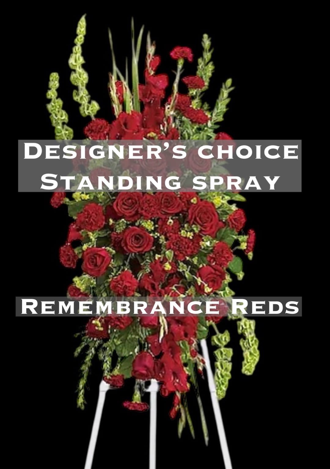 Sympathy Tribute on Easel *DESIGNER'S CHOICE* REDS - This elegant, all red funeral spray conveys compassion and deep devotion. Presented on a traditional easel, it features a beautiful array of red funeral flowers accented with unique bells of Ireland and other graceful greens. Orientation: One-Sided approx 60" tall x 24" wide  **Photo features Deluxe design. 