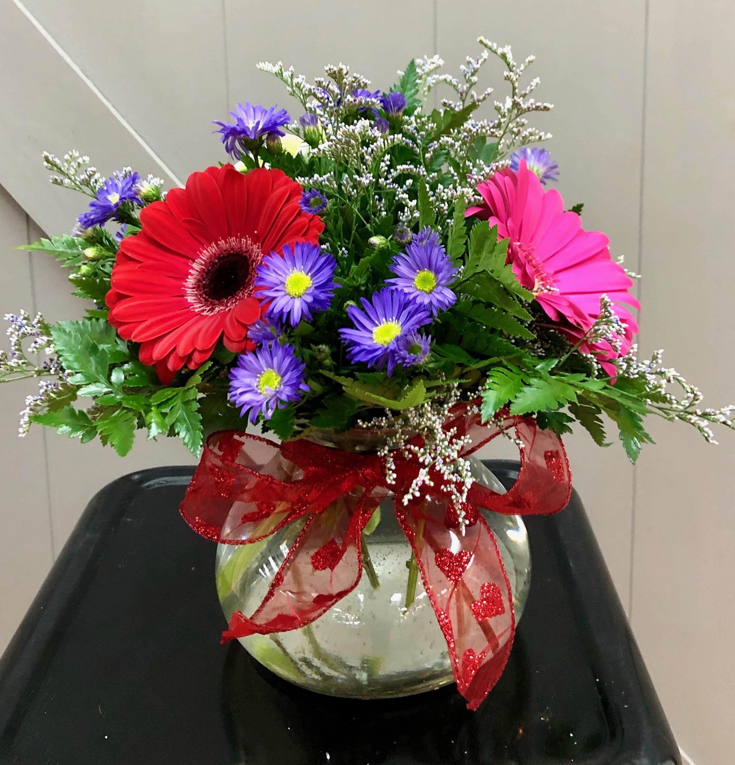 Gerbs are Great! - Three bright colored gerbera daisies with filler flower in a sweet short vase are sure to make any one's day brighter!  Colors will vary depending on availability. 