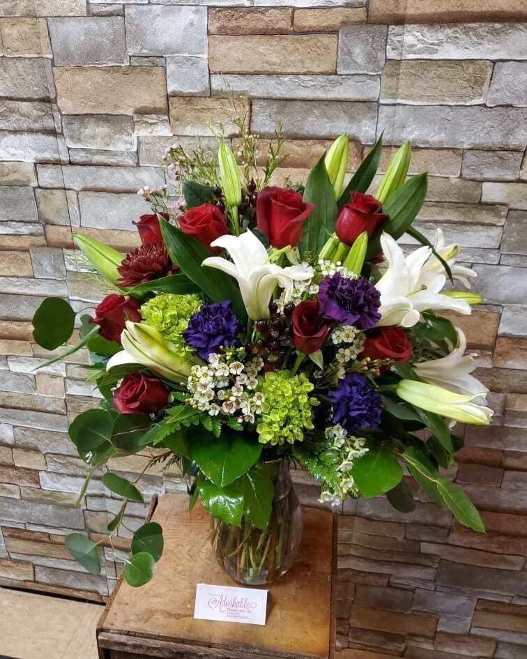 Luxurious Mixes - Designed with fresh flowers. This product is one sided design.  * Some stages of flower life may vary. (Example: Lilies may be more open than imaged.)  Flower shortages and product availability means that some substitutions will apply. Value will always be filled.  This bouquet might include eucalyptus amongst the greenery. It may be toxic to pets including but not limited to Cats and Dogs if digested.