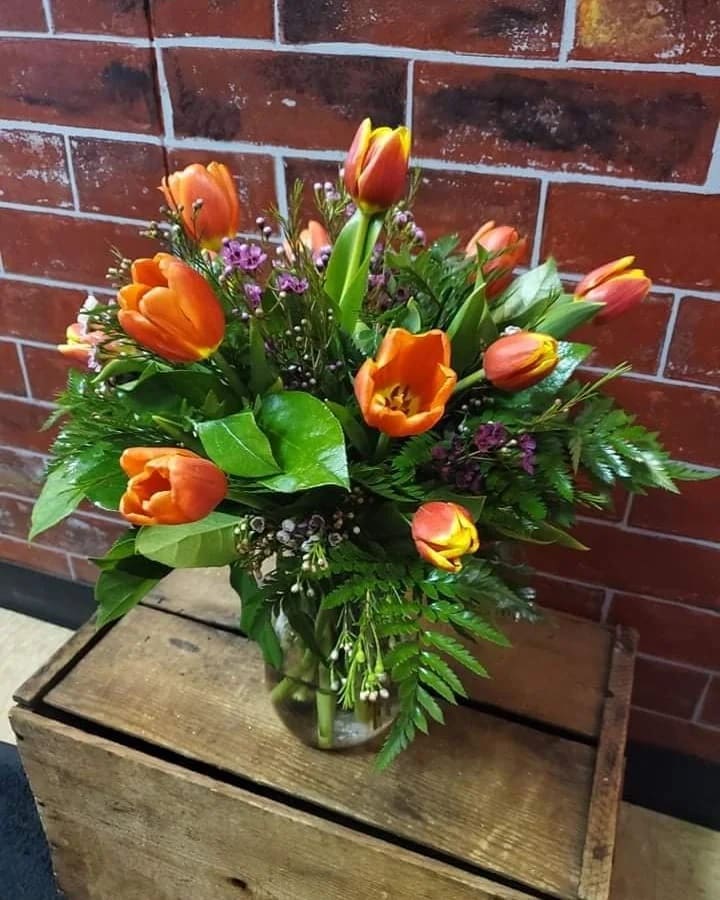 Vase of Tulips - Orange - A beautiful all around arrangement of tulips and filler flower  * Some stages of flower life may vary. (Example: Lilies may be more open than imaged.) Flower shortages and product availability means that some substitutions will apply. Value will always be filled. This bouquet might include eucalyptus amongst the greenery. It may be toxic to pets including but not limited to Cats and Dogs if digested.
