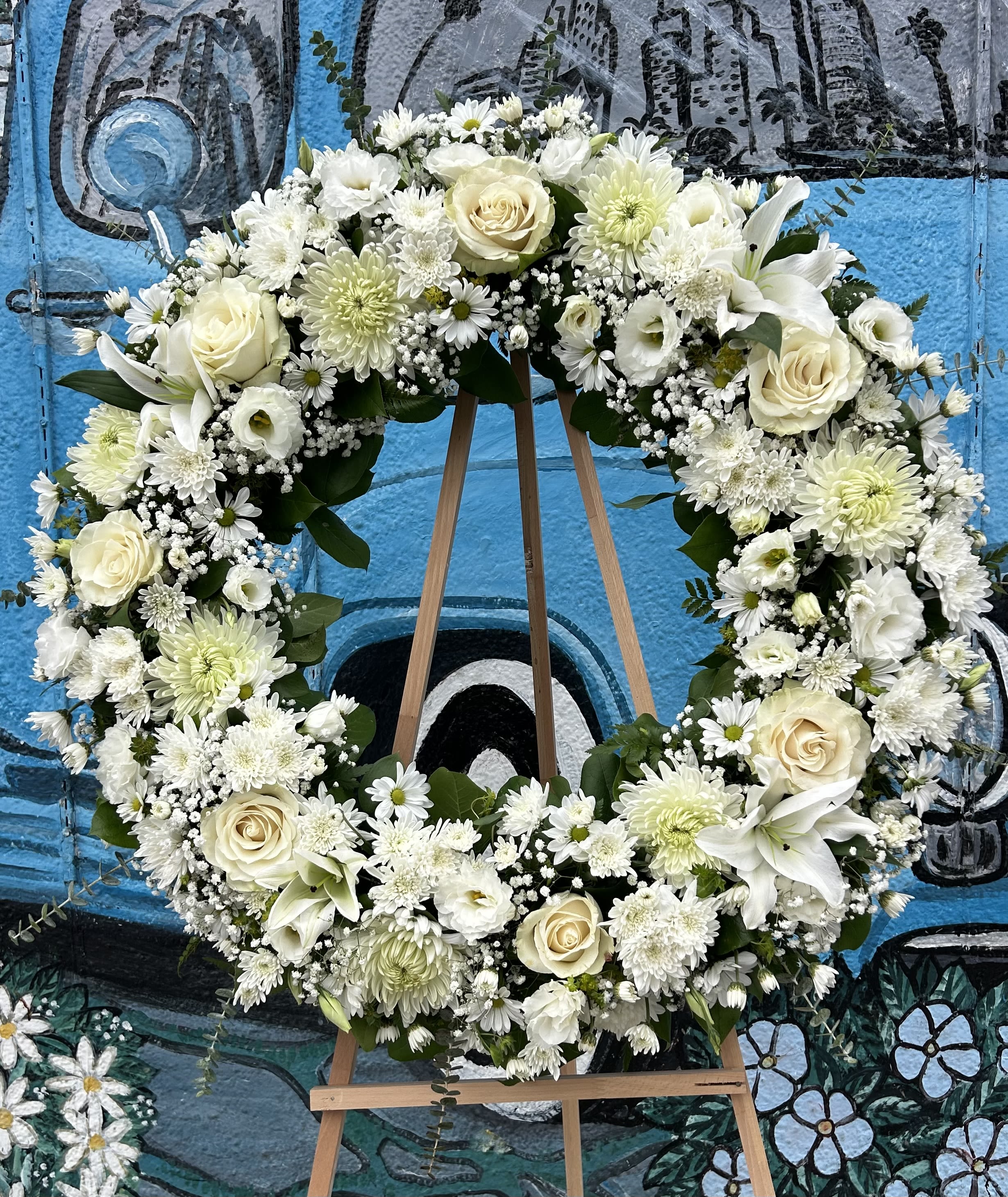 All White Wreath  - Seasonal White Flowers arranged into a wreath. 