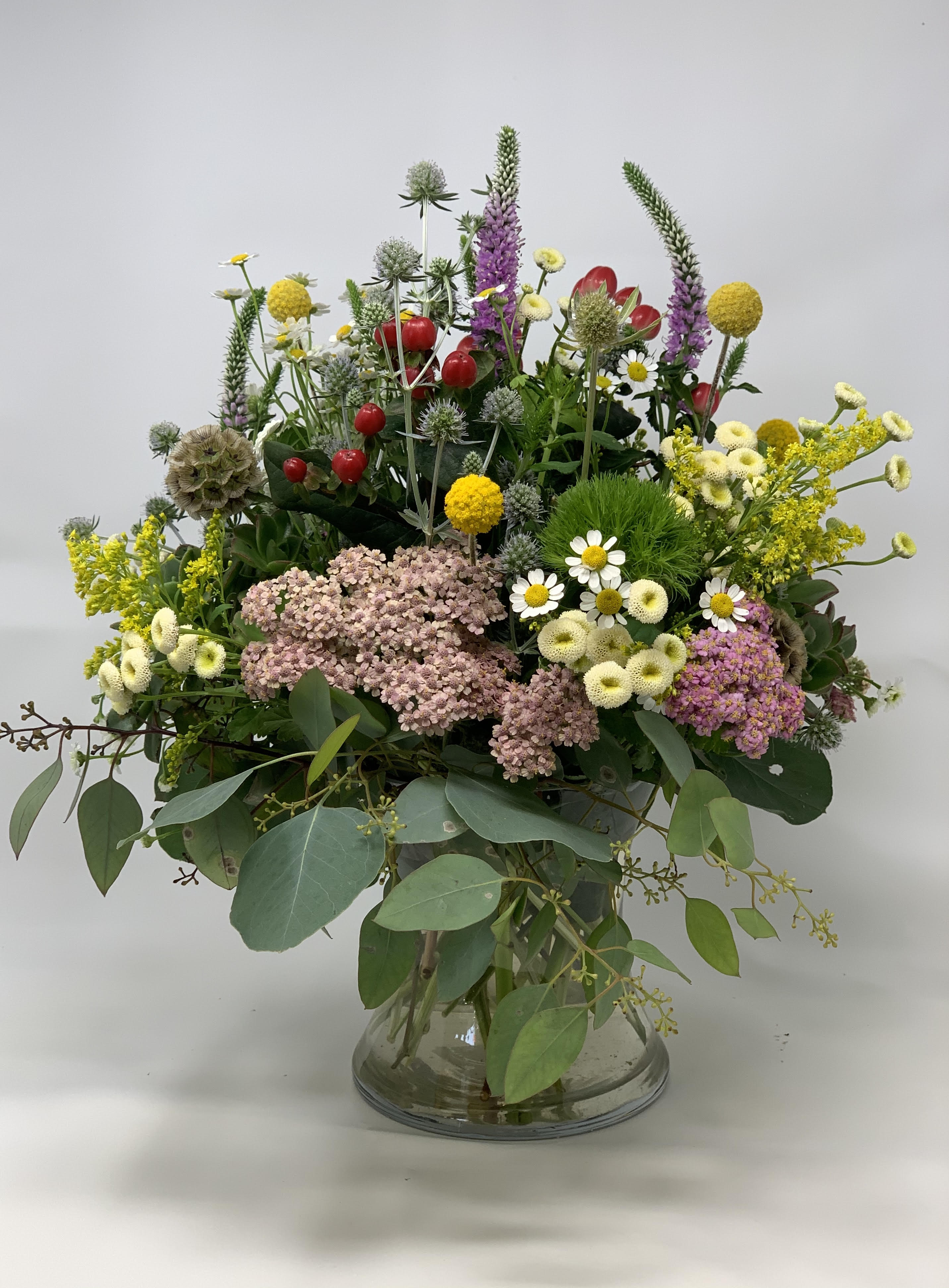 Nature's Calling - An array of wild fillers and succulents. Approximately 10" x 16" in size.   NOTE: Seasonal flowers are used so arrangements may slightly differ