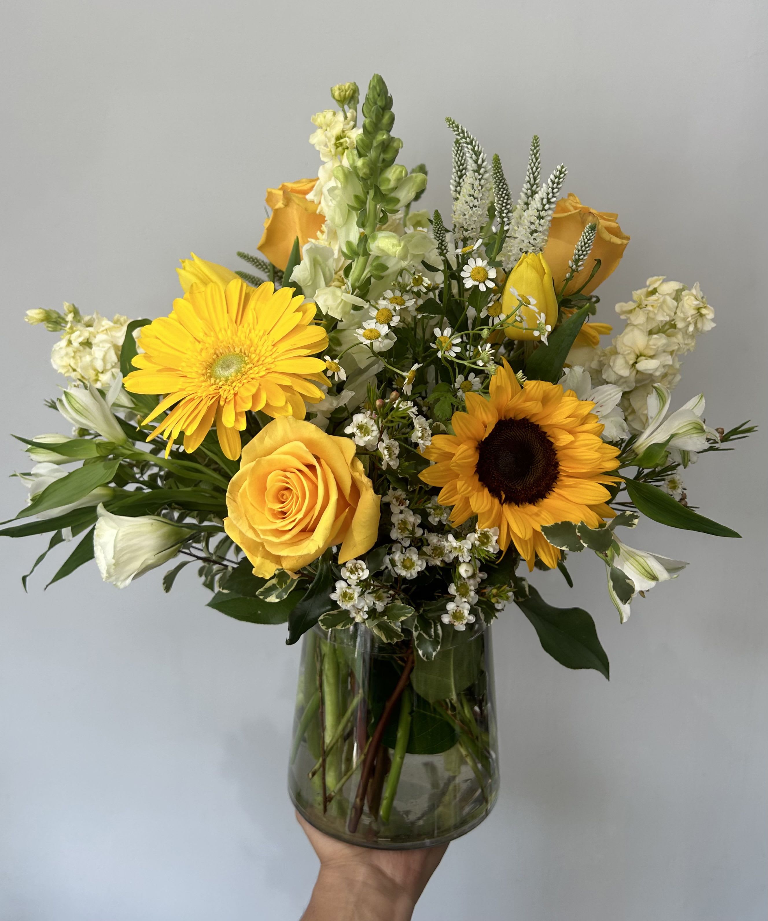Peaceful Happiness - Seasonal white and yellow flowers arranged into a vase with fillers and greens. 