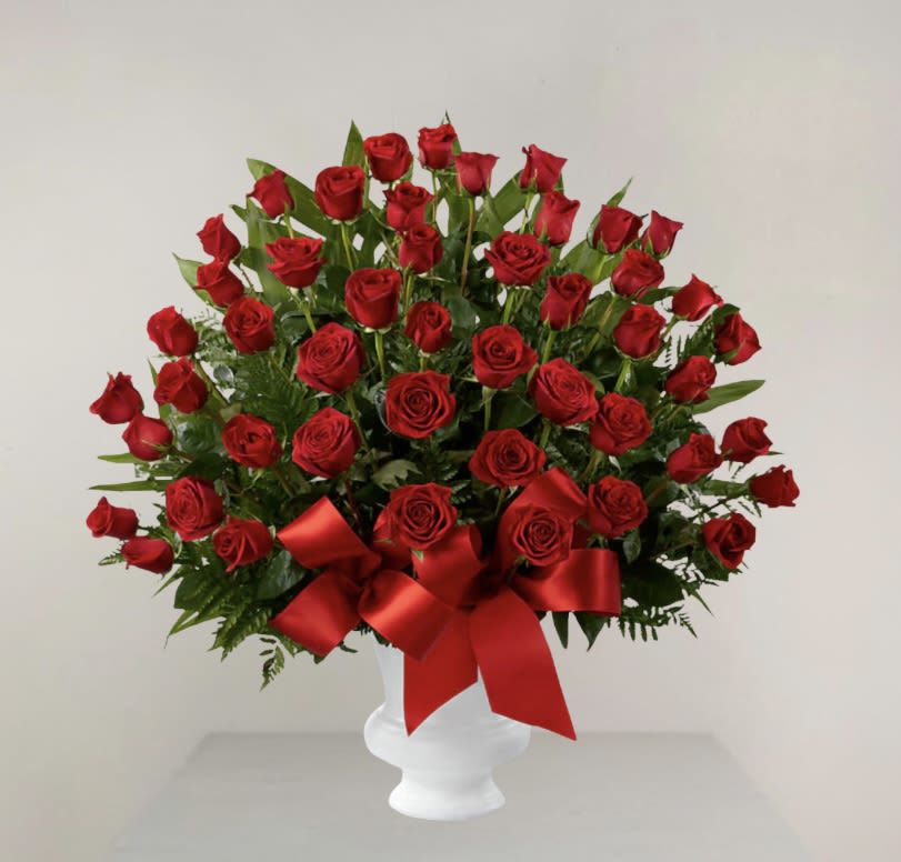Red Rose Basket  - Crafted with deep red roses, this elegant arrangement pays a heartfelt tribute to a life cherished and a love never forgotten. 