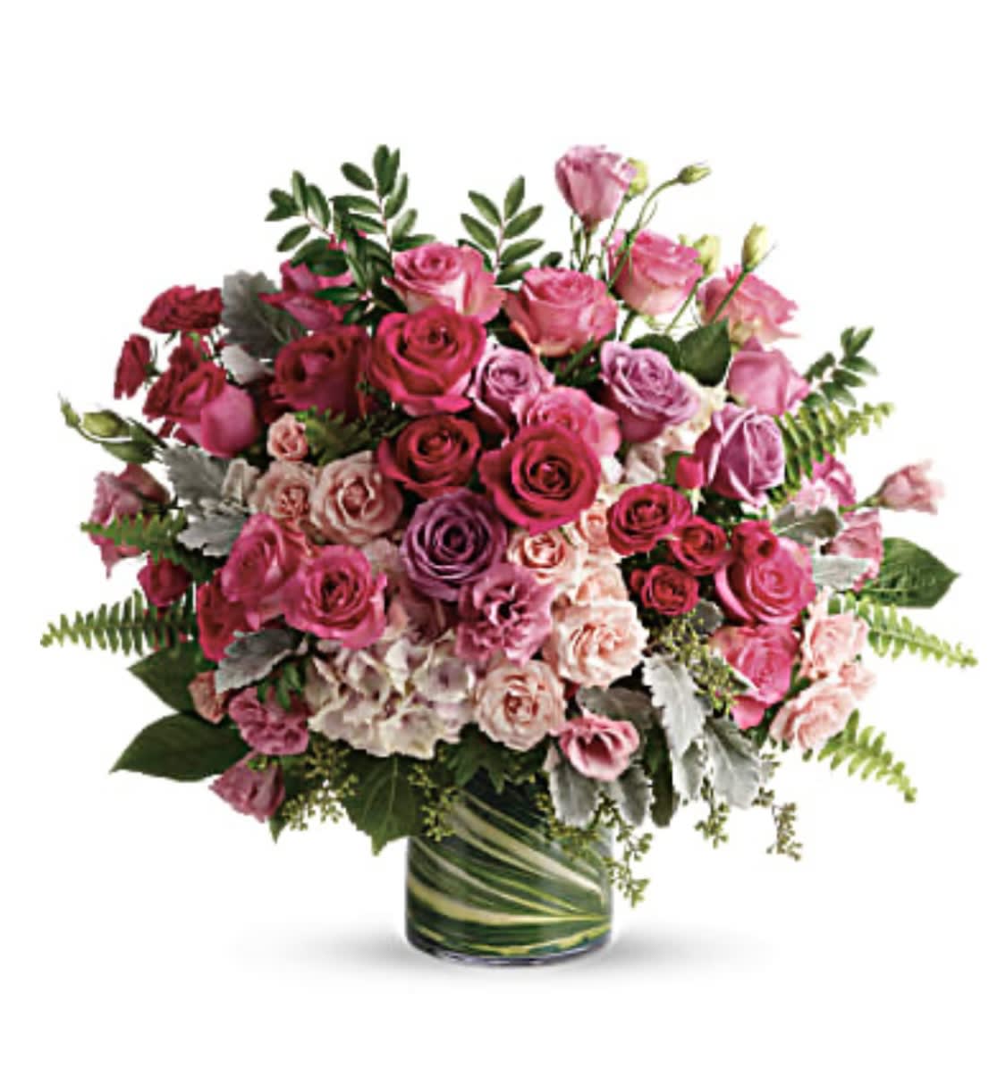 Haute Pink Bouquet - Spoil them rotten with this heavenly, high-fashion rose creation! Ravishing roses in every shade of pink create a grand gift that will live in their heart forever. This gorgeous bouquet includes light pink hydrangea, hot pink roses, lavender roses, pink roses, hot pink spray roses, light pink spray roses, pink lisianthus, dusty miller, huckleberry, sword fern, seeded eucalyptus, lemon leaf, and variegated aspidistra leaves. Delivered in a large glass cylinder vase. Orientation: one side