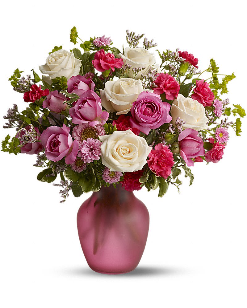 Rose Medley - Does someone you know love roses? Then they'll love this lush, fresh pink medley of blossoms mixed with a generous helping of fragrant roses. Delivered in a glass sweetheart vase, it's a pleasing bouquet that's perfect for a birthday, anniversary or any day of the year. Roses and spray roses are mixed with fresh flowers such as miniature carnations and Matsumoto asters - in shades of white and pink - and delivered in a glass vase.Approximately 14 1/2" W x 16" H