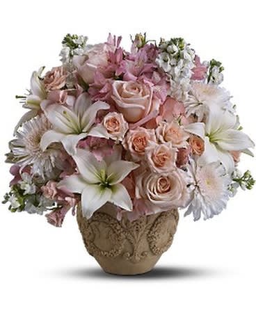 GARDEN OF MEMORIES - Fragrant roses, Asiatic lilies and mixed fresh flowers in gentle hues of pink and white are gathered to create this lovely bouquet. Delivered in a garden urn, it's a thoughtful token of your high esteem and devotion. A mix of fresh flowers such as roses, Asiatic lilies, hydrangea, stock and Cremon chrysanthemums – in shades of white and pink – is delivered in Teleflora’s Garlands of Grace urn.  Approximately 17" (W) x 18" (H)