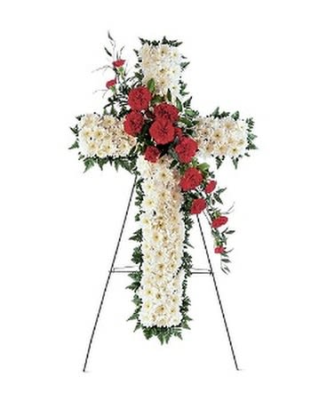 HOPE AND HONOR CROSS - This striking red and white cross honors your loved one in a faithful way. One white chrysanthemum solid-flower cross on an easel arrives decorated with a cluster of red carnations.  Approximately 26" W x 35" H