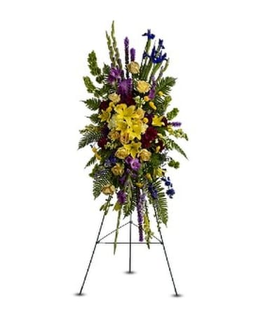 IN LOVING MEMORY SPRAY - Show your thoughtful consideration and good wishes at a funeral, wake or memorial service with this magnificent yellow, green and purple standing spray, featuring over a dozen different varieties of blossoms. Delivered on an easel, it's ready for display. A standing spray of fresh flowers such as roses, Asiatic lilies, iris, gladioli, snapdragons and carnations – in shades of yellow, purple and green – accented with ferns – is delivered on an easel.  Approximately 25" (W) x 50" (H) (Dimensions do not include easel.)