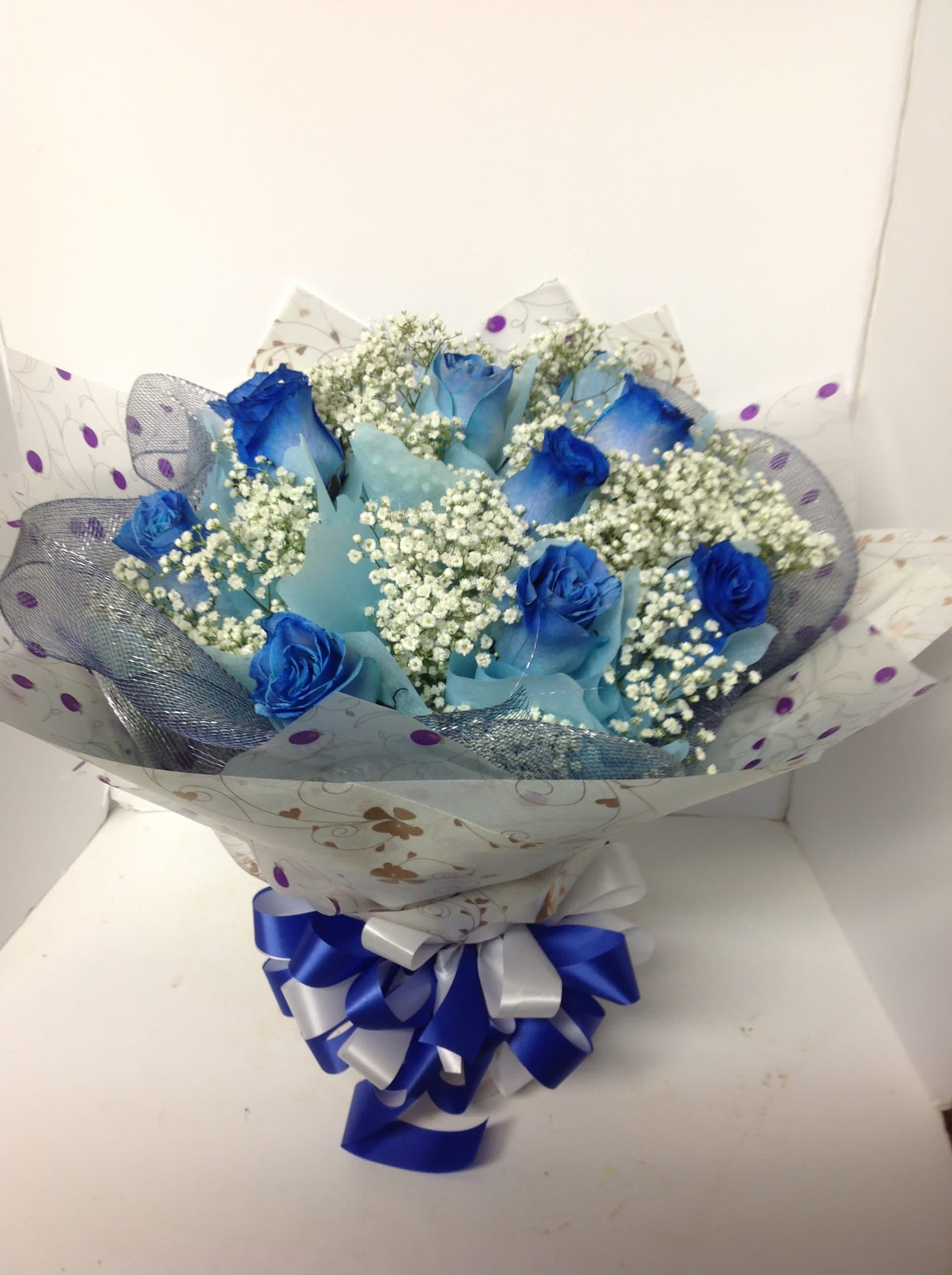 Love and Romance #4 - A beautiful display of flowers wrapped in the Hong Kong style. Colors and variety may change. Please call for details.