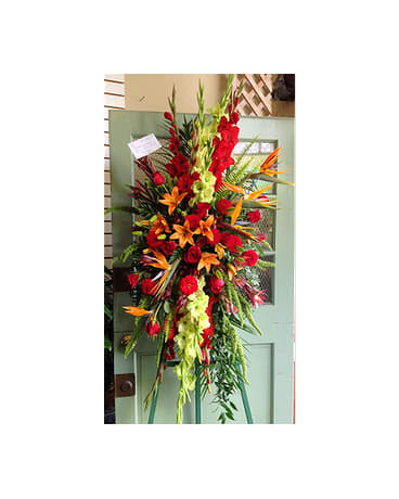 SYMPATHY SPRAY - SYM-059 - A beautiful standing spray in reds and oranges - roses, birds of paradise, gladiolus, lilies, dahlias. Flower selection subject to availability. 