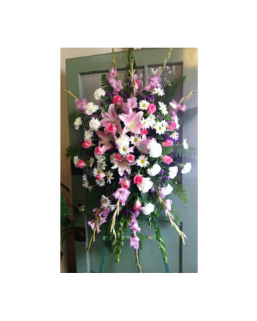 SYMPATHY SPRAY - SYM-093 - A beautiful standing spray with assorted pink, white and purple flowers.  Flower selection subject to availability.  **Prices may vary for non local delivery.
