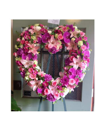 EUROPEAN HEART - SYM-089 - A beautiful and elegant European-style wreath in a heart shape with assorted pink flowers.  Flower selection subject to availability.  Picture is Premium Size. 