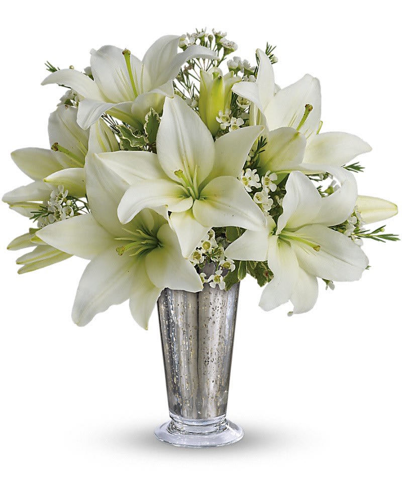 Written in the Stars - This classic silver and white arrangement is a stunning way to let that special someone know how you feel. Inspired by a romantic night sky, it's a dazzling way to pay homage to your years together. Elegant white lilies and pretty white waxflower stems are exquisitely arranged in a silver Mercury Glass Antique vase that's reminiscent of a star-filled sky. It really is a wish come true.