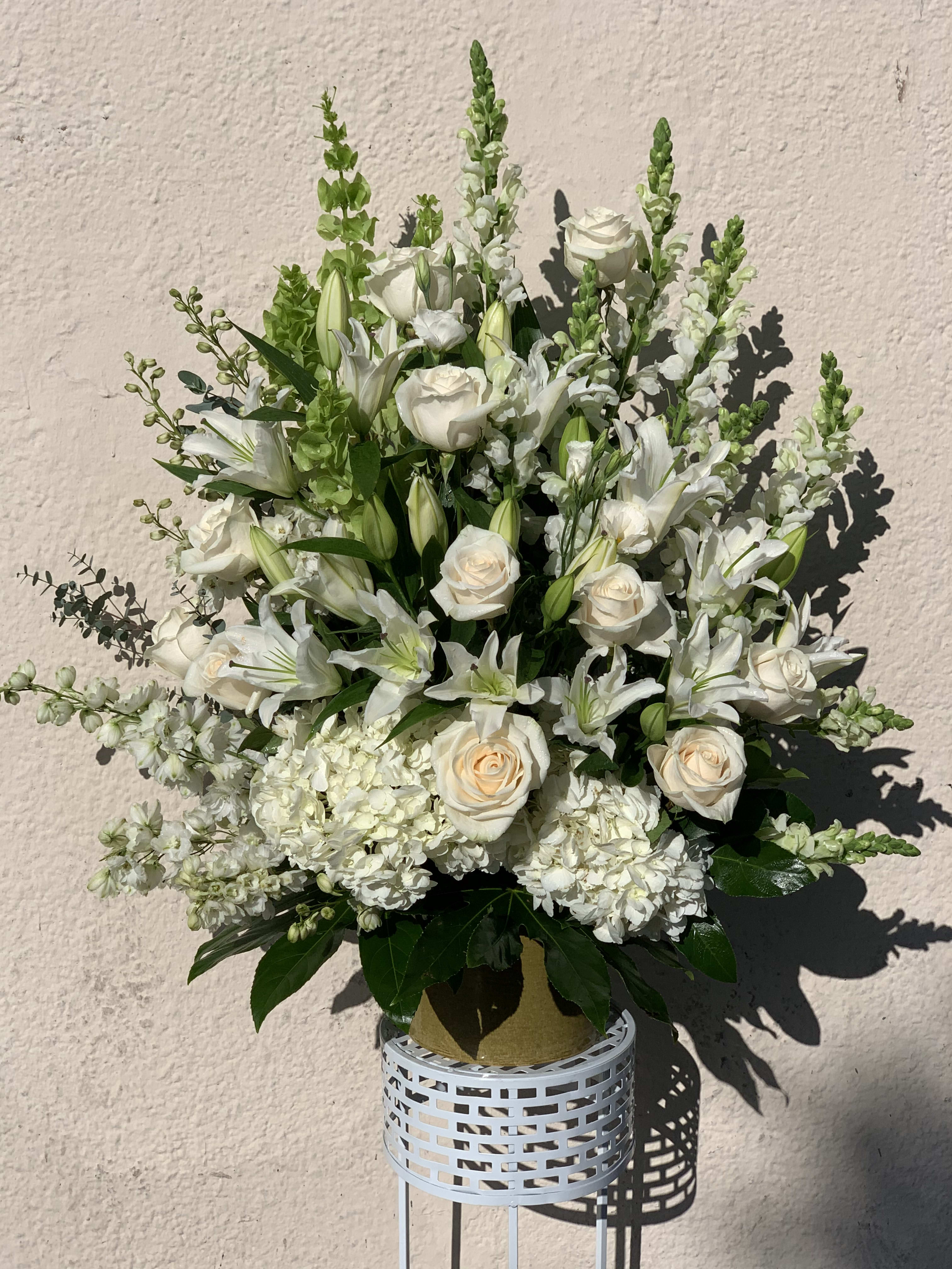 Moonstone - May contain white roses, snapdragons, hydrangeas and lily stargazers fitted into an arrangement.  *Order must be placed 2 - 3 days in advance* (Please note, same day pick-up or delivery is not available for this product) 