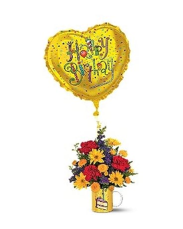 Birthday Surprise Bouquet - Deliver birthday wishes and bouquet dreams to a favorite friend. This cheerful burst of flowers in a slice-of-cake mug comes with a colorful "Happy Birthday" balloon, for an extra touch of fun! A ceramic Mugaloonâ¢ decorated with a fun birthday design, plus an 18" heart-shaped "Happy Birthday" foil balloon. The bouquet includes red carnations, purple larkspur and yellow daisy spray and button spray chrysanthemums. Approximately (without balloon: 12" (H) x 9" (W) Orientation: All-Around As Shown : 06N300B