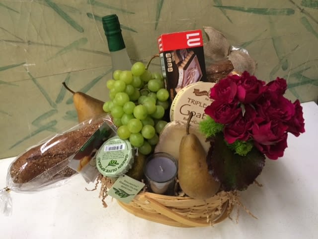 Ooh La La Gift Basket "Picnic" - Gift Basket for a picnic in the park. Woven basket. Baguette, fruits, cheese spread, flowers in vase, cookies, refreshing beverage, fruits, scented candle. Depending on when the Gift Basket is ordered, specific availability of items in picture may vary. But the style, quality, and feel of the assortment will remain the same.