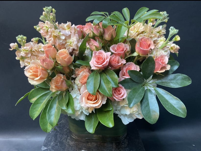 Gloria - Classic, will stand the test of time.  Spray Roses, White Hydrangea, stock  We use flowers that are available at that given time. The look and the freshness of the flowers are always the most important, therefore the arrangement may vary. Substitutions may be made based on best product available.