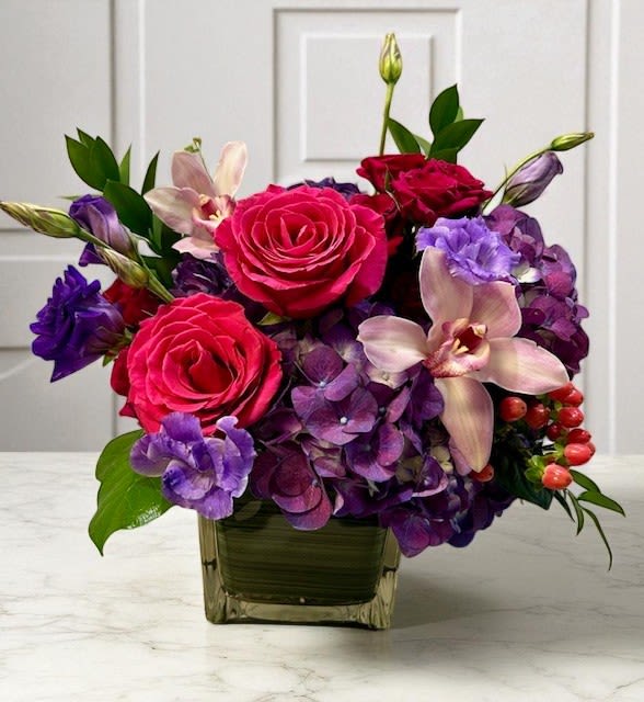 Wildberry Bloom - A fresh and vibrant mix of purple and pink tones, artfully arranged with seasonal flowers. This cheerful design brings a touch of elegance and charm, perfect for brightening any moment or celebrating any occasion.