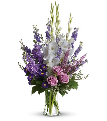 Joyful Memory - Lavender and white sympathy flowers make a grand statement in this joyful bouquet. Cherish your memories with this lasting remembrance of lavender larkspur and roses deep purple asters pure white gladioli and the softest pink heather. A classic assortment of flowers such as lavender larkspur stock and roses plus purple asters white gladioli and pink heather.Approximately 20" W x 32" H Orientation: One-Sided As Shown : T251-1A