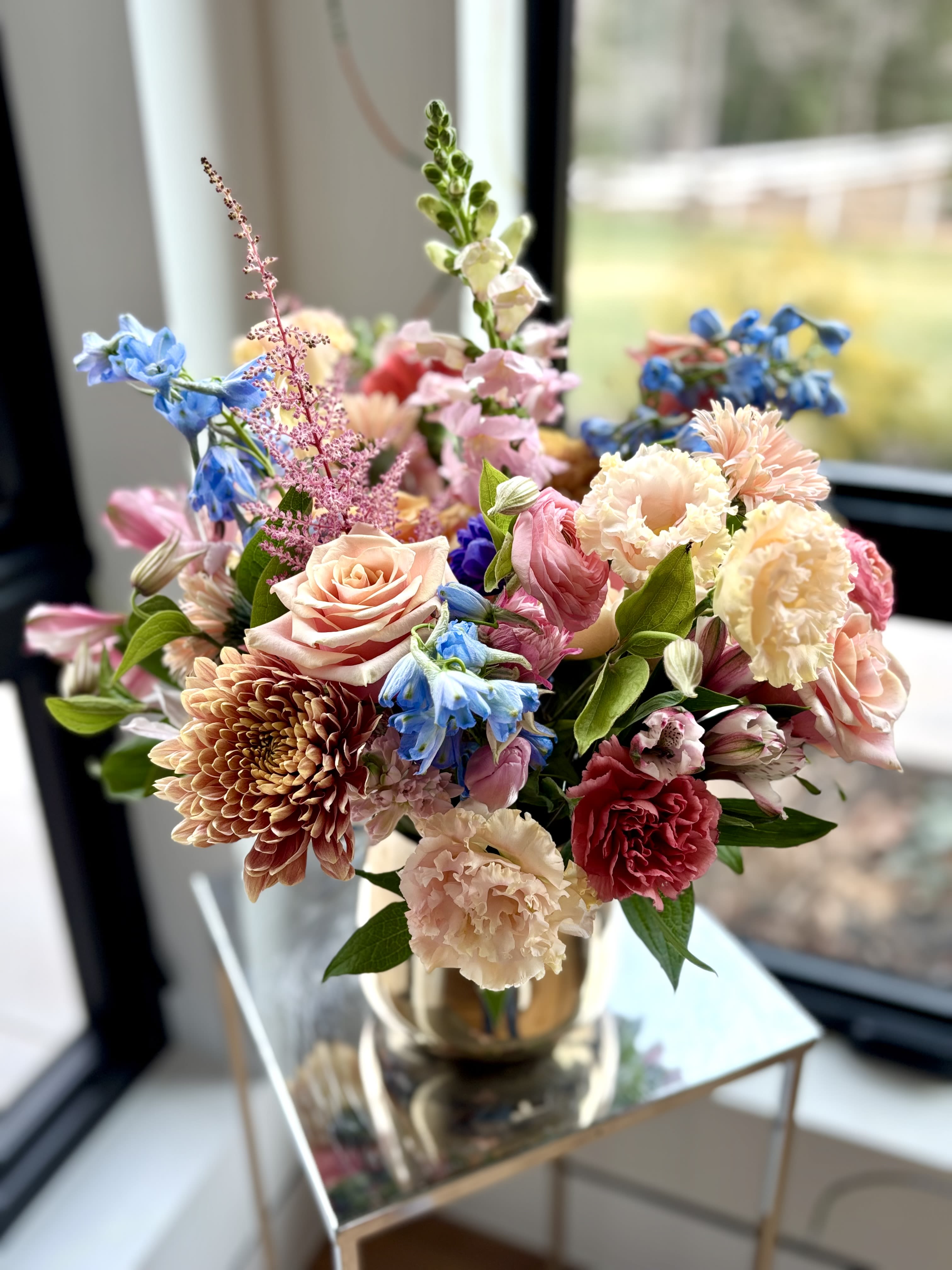 Michaela's Flower Surprise - Designer's Choice - Michaela's signature garden style with her unique selection of premium flowers, floral textures and greenery to surprise  your Special Someone. Whether you celebrate Valentine's Day, Galentine's Day or you just want to make someone's day better, this is a perfect choice. Michaela selects a beautiful mix of flowers and designs each arrangement as unique as their recipients.