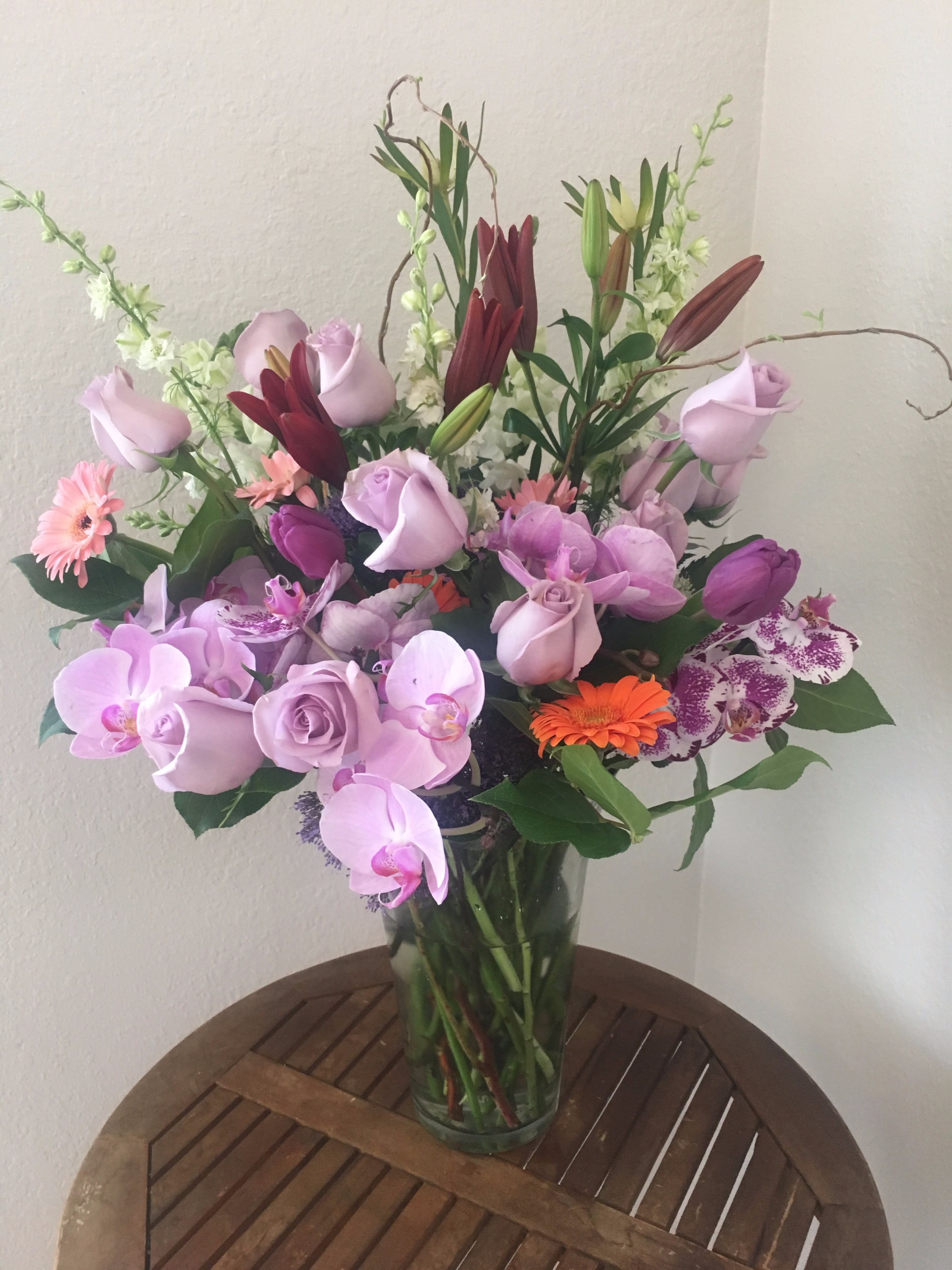Lovely lavender - Lavender orchids and roses blended with a touch of color makes for a lovely mix for any loving occasion.