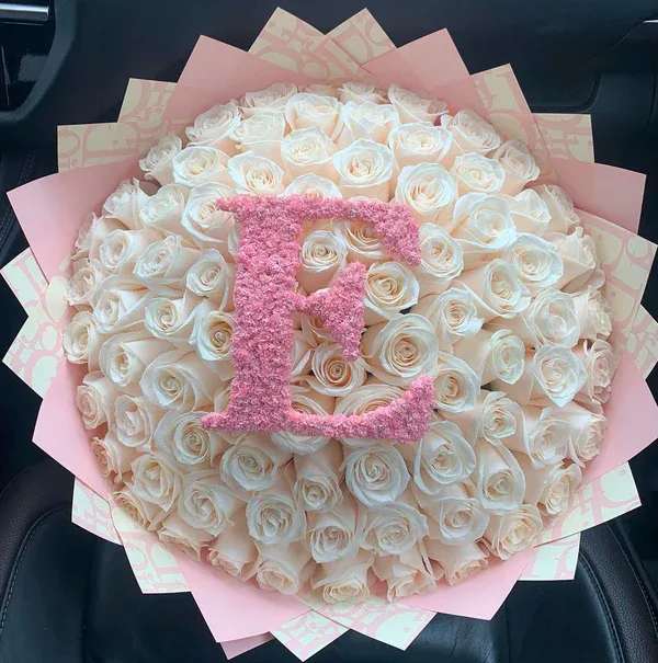 My Baby Bouquet - The perfect bouquet fully customized Bouquet with the initial of your choice with long white stem roses with pretty Dior paper. 