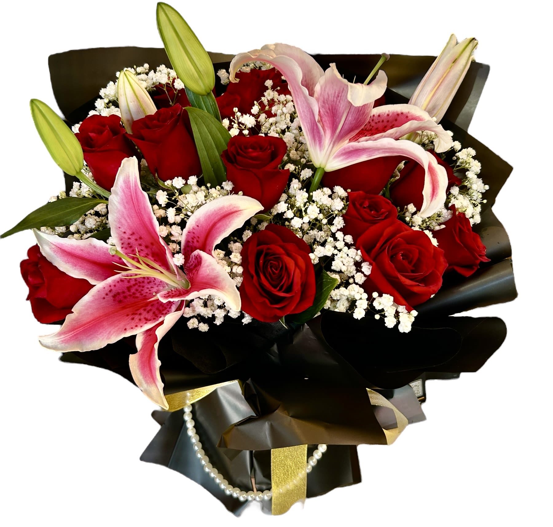 Eternal Passion - A stunning arrangement that speaks the language of love. Featuring deep red roses for timeless romance, stargazer lilies for admiration and prosperity, and delicate baby’s breath to soften the bold beauty — all wrapped in elegant black with golden accents. Perfect for anniversaries, declarations of love, or unforgettable celebrations.