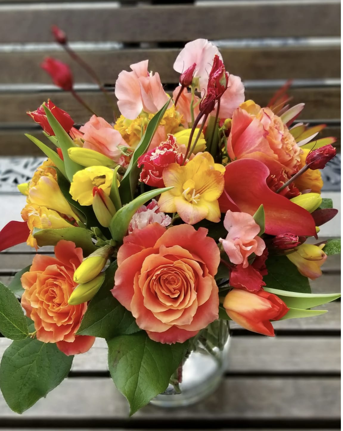 Burning Bright - Vibrant flowers shine bright in this arrangement