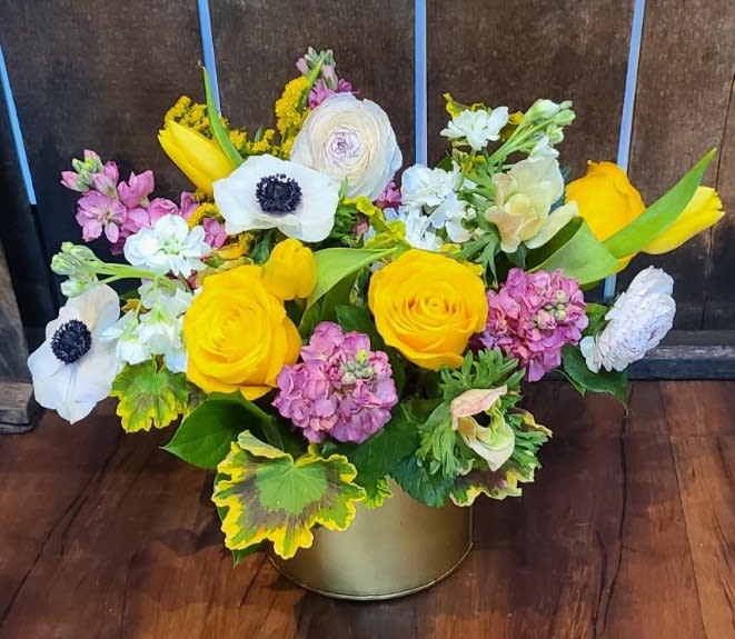 Gold Rush - With pops of color, and gorgeous imported Anemones, Ranunculus, and Roses this arrangement makes for a perfect midweek pick me up for anyone!
