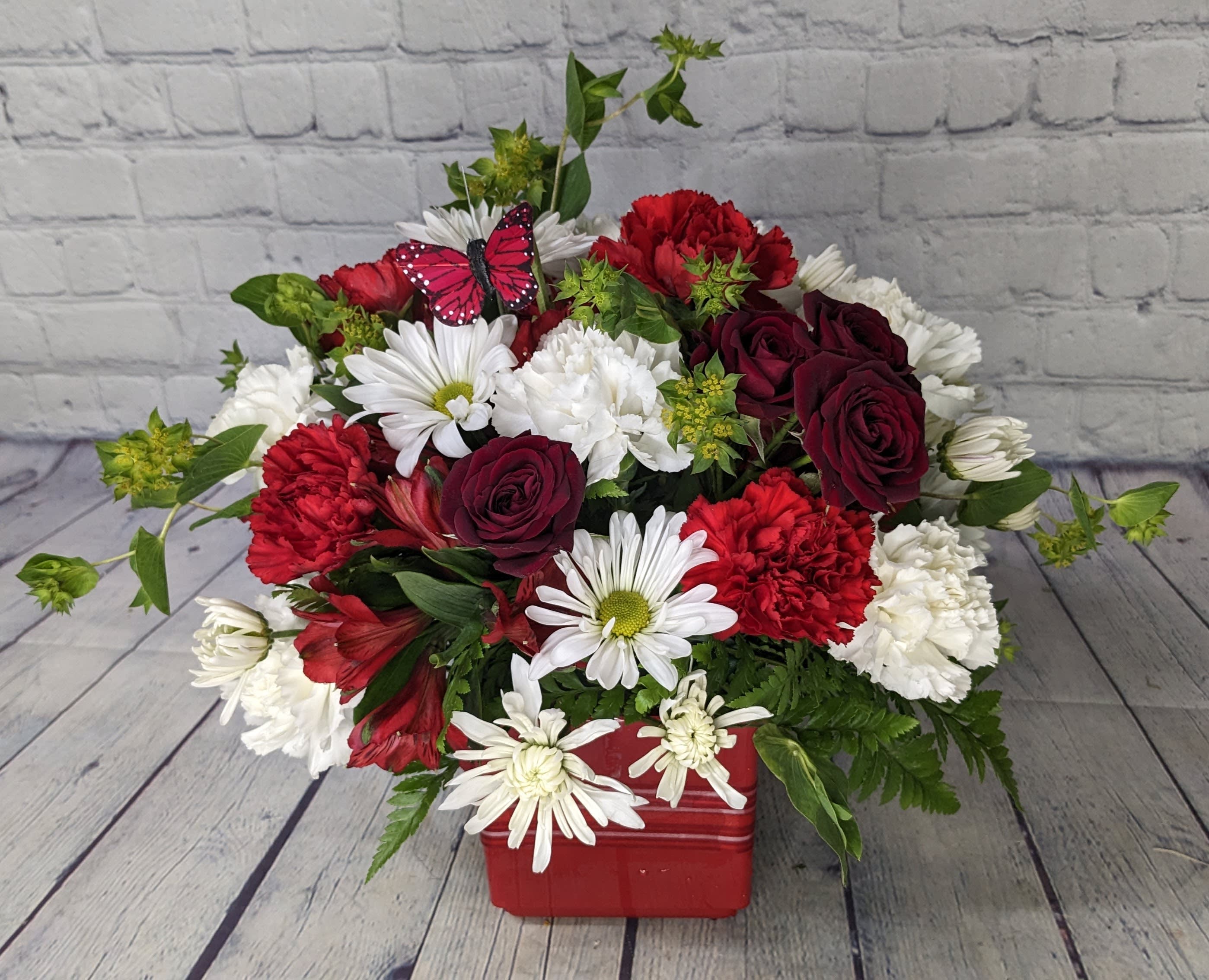 Celebrate You - Let's celebrate Mom and acknowledge all that she does for us! This adorable bouquet is filled with long lasting flowers to keep reminding her of just how important she is to you. 