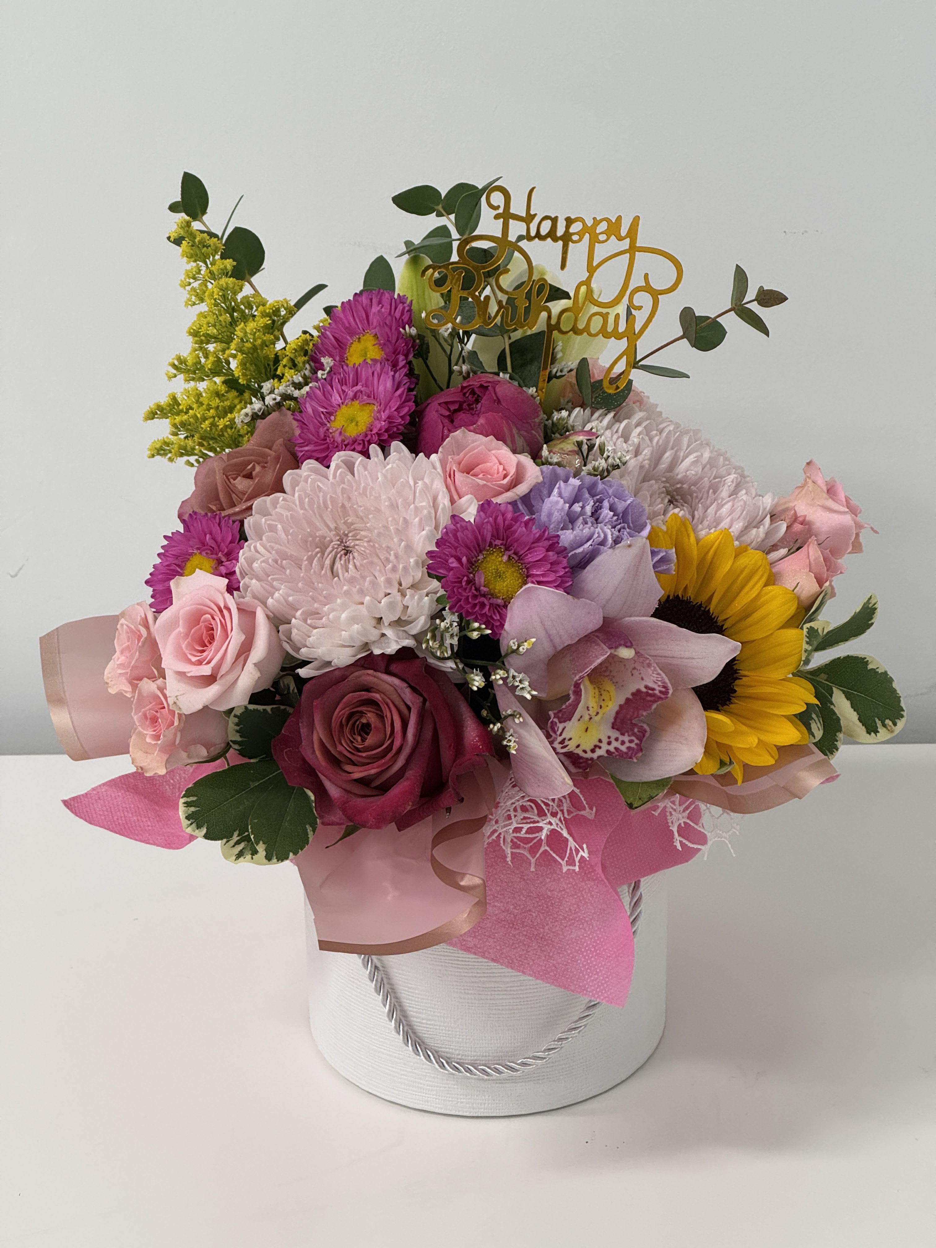 Surprise garden box  - Delight someone special with our Pastel Garden Arrangement, a breathtaking blend of soft, romantic hues inspired by a blooming spring garden. Each arrangement is artistically handcrafted to capture the charm of a blooming garden—perfect for birthdays, anniversaries, or simply to brighten someone’s day. Picture shows Deluxe. Birthday pick included we can exchanges for congratulations or happy anniversary. Must specify ocassion and we will match the pick. 