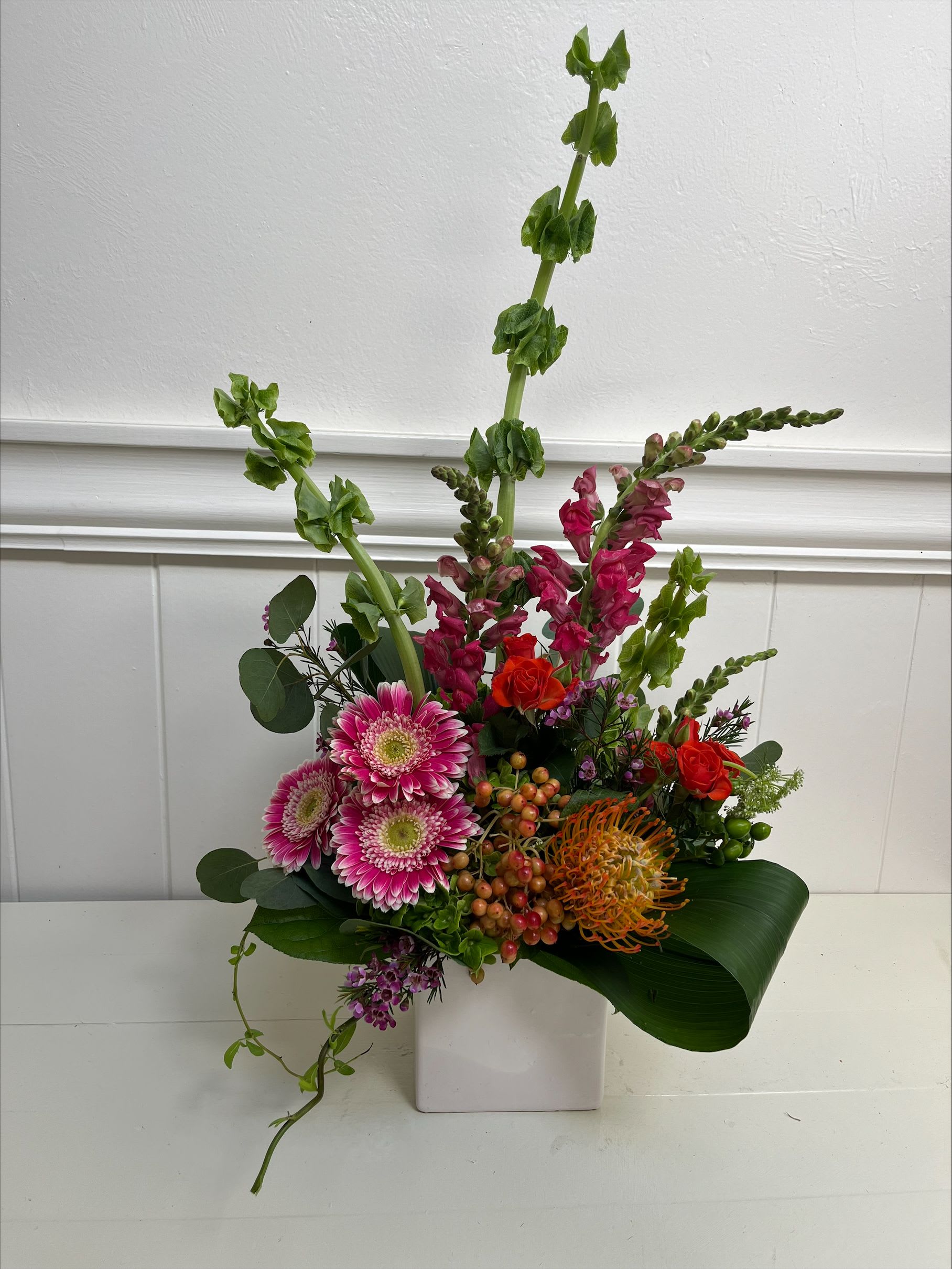Garden Party - High-style, extraordinary colors in a stunning asymmetrical arrangement. Types of flowers may vary depending on seasonal availability. Perfect gift for a birthday or celebration of any sort. 