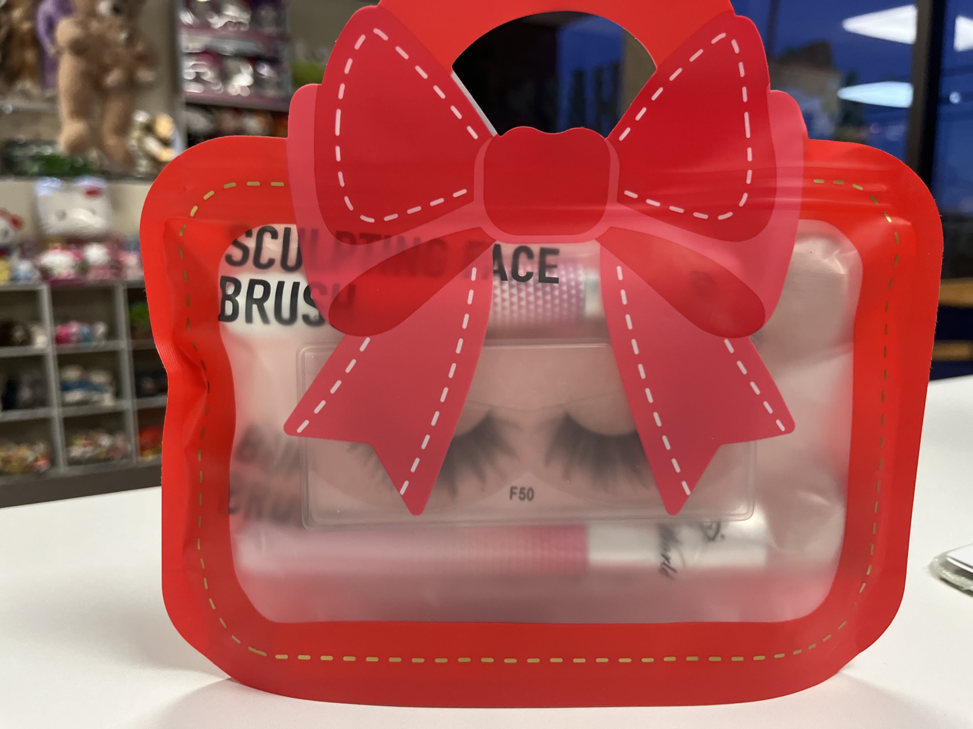 Beauty Gift  - Make up brushes and eye lashes in purse setting 