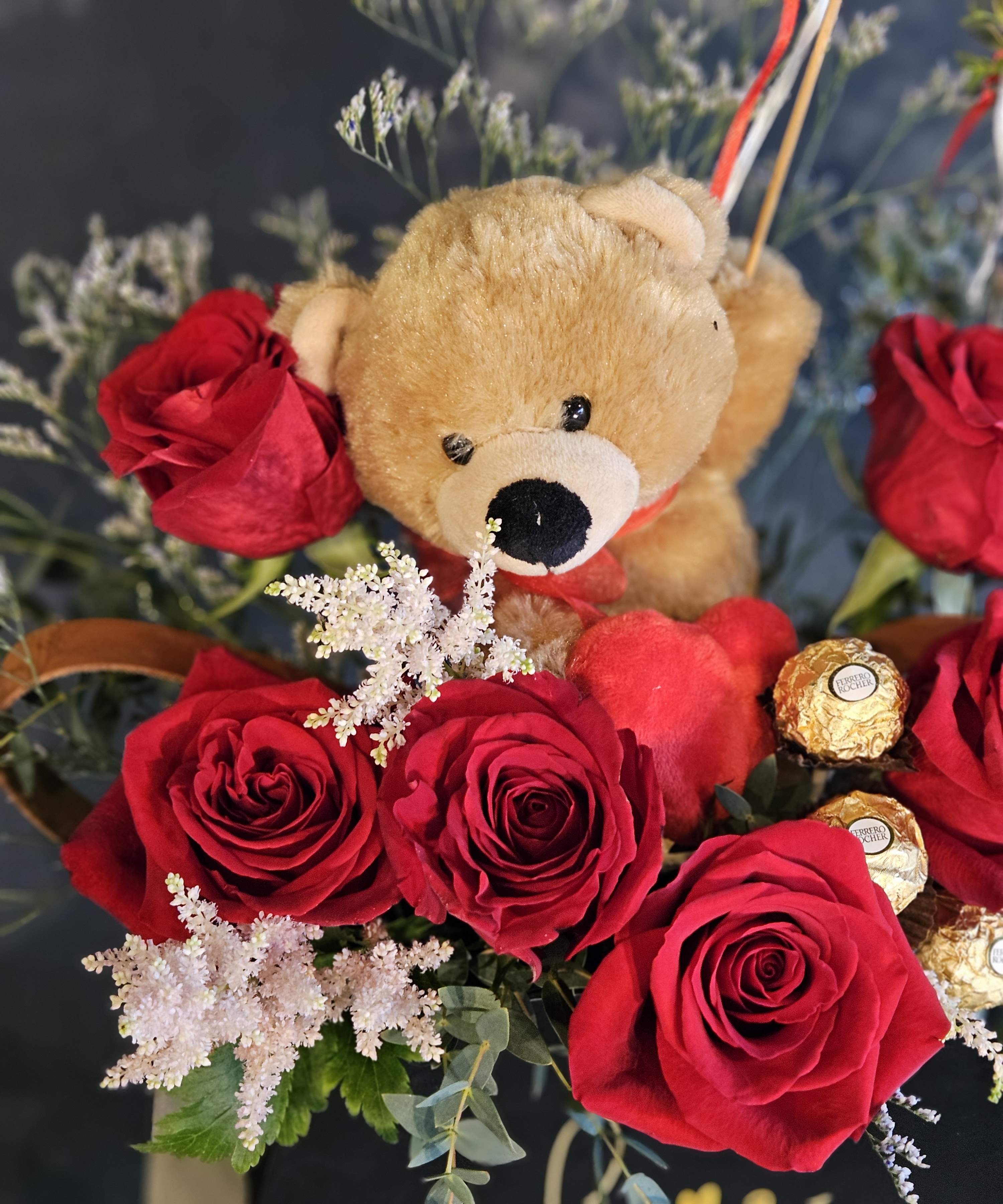 SG-48  - Arrangement with a bear plush and chocolates is Deluxe. Something different and cute for your loved ones. - small to medium size -  * For Valentine's Day - plush, red rose, and chocolate will be available  ***** PLEASE READ ****** * For Valentines day, the branches will be substitute with other line flowers. * The box is made with cardboard so it will need a extra care when you add water.  * If you are worried about it, please leave a note for florists to substitute with other vase such as clear glass vase or ceramic vase. We will substitute without any extra charge. *Colors of Boxes are subjects to change  Due to various seasonal and regional conditions, and the variety of unplanned issues courtesy of Mother Nature, availability of some flowers may be very limited in certain areas.  In this event, we will substitute with a second choice of similar flowers and container of equal value and beauty. Every effort will be made to maintain size, shape, and overall color schemes of an arrangement. Our goal is your complete satisfaction, rest assured that every effort will be made to provide an arrangement of equal or greater value. 