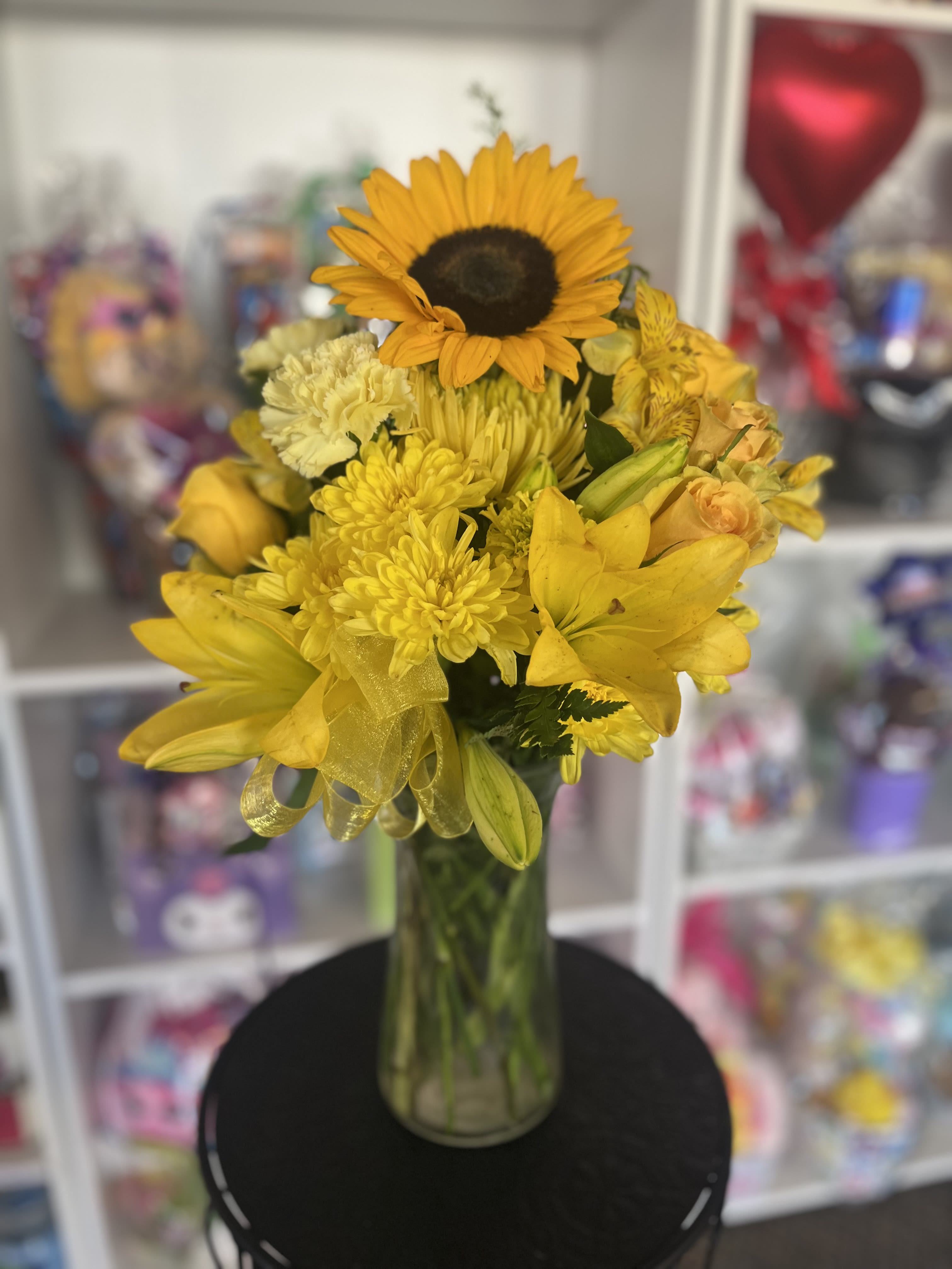 Yellow Blossom  - fresh yellow flowers in clear vase 