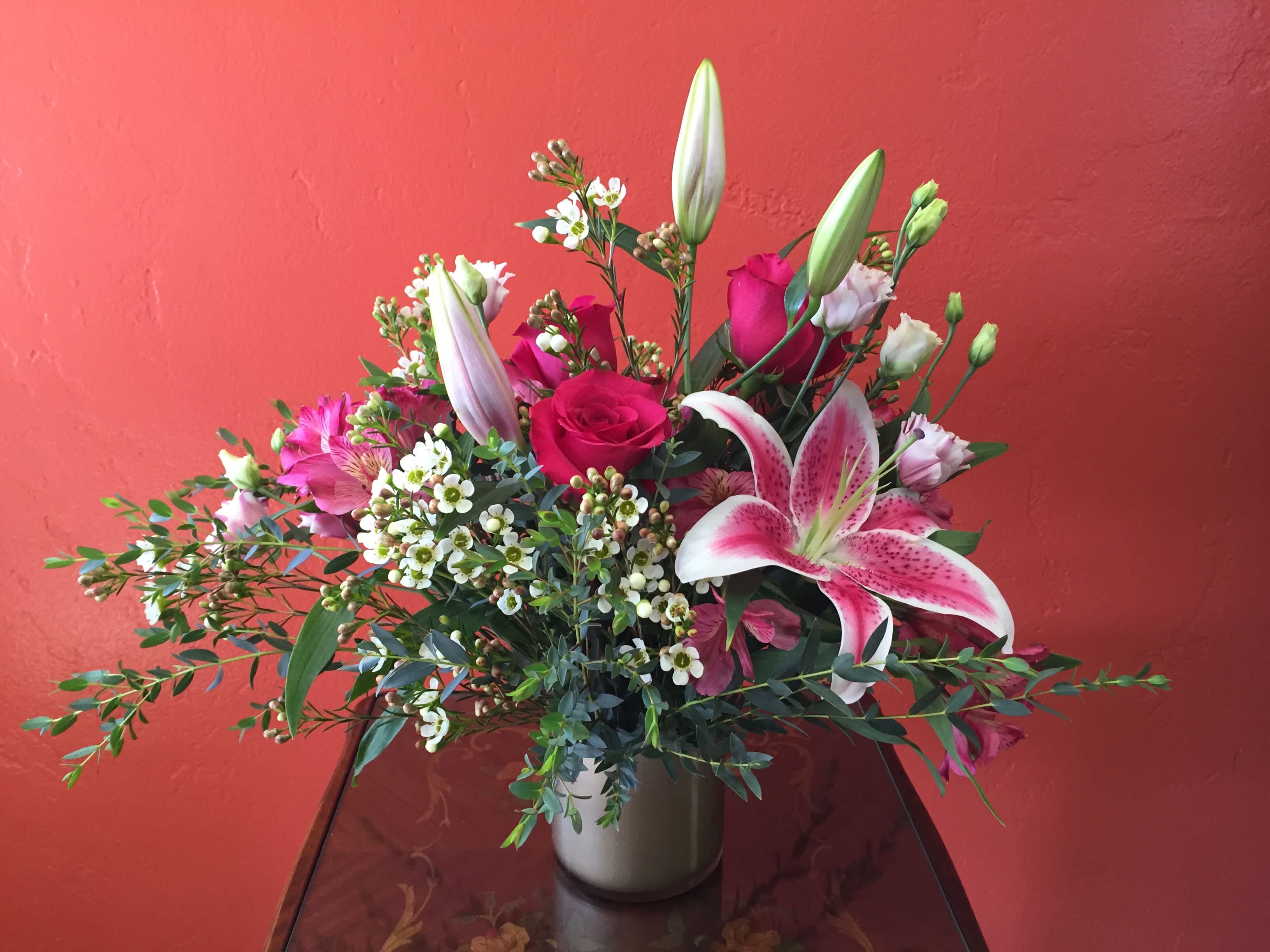 Isn't She Lovely? - Isn't she lovely? Isn't she beautiful?  Here is a floral arrangement to say just that!  Gorgeous lilies, roses and alstromeria are complemented by greenery and waxflower.    