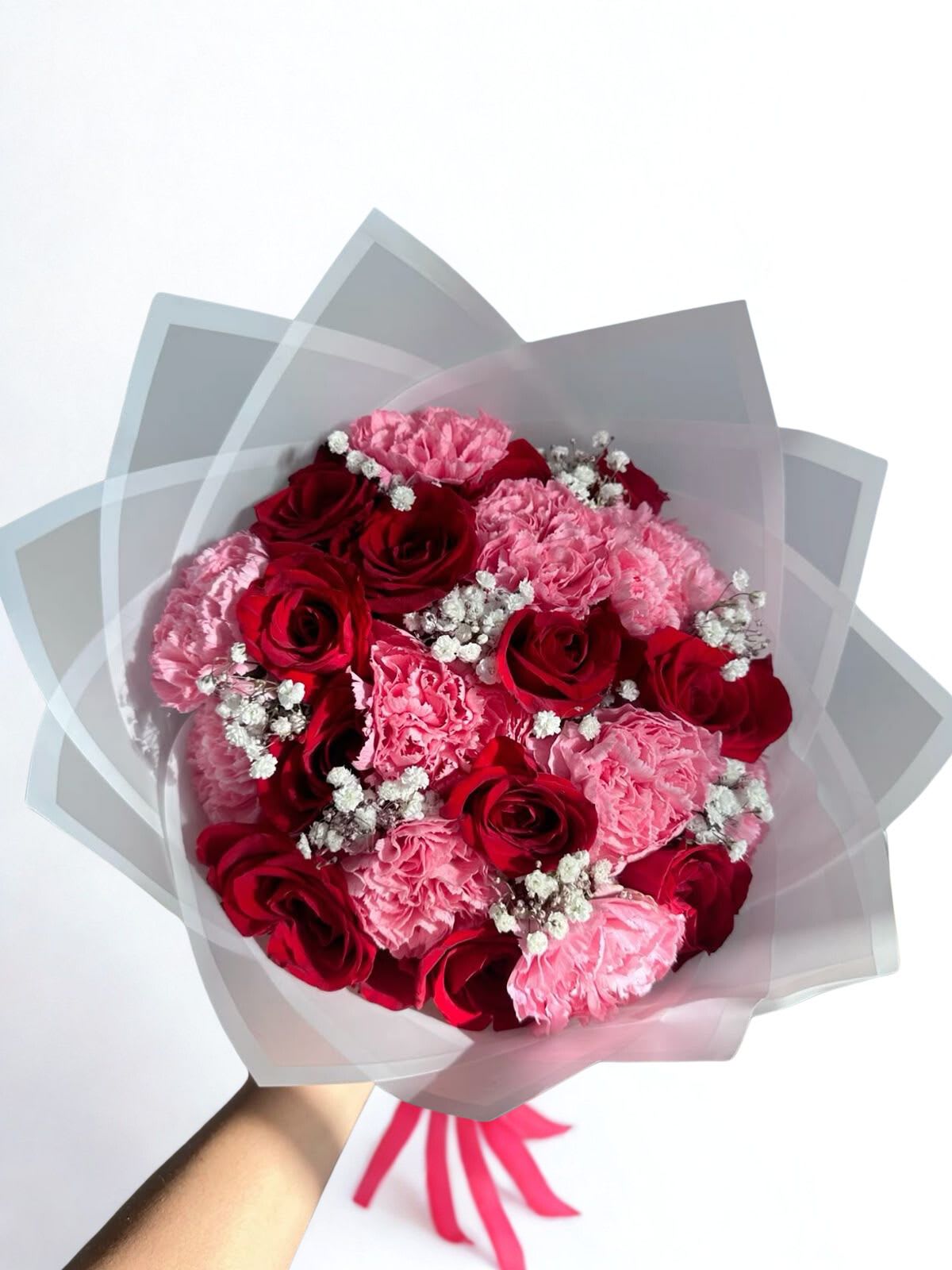 romance - bouquets of red roses and pink carnations