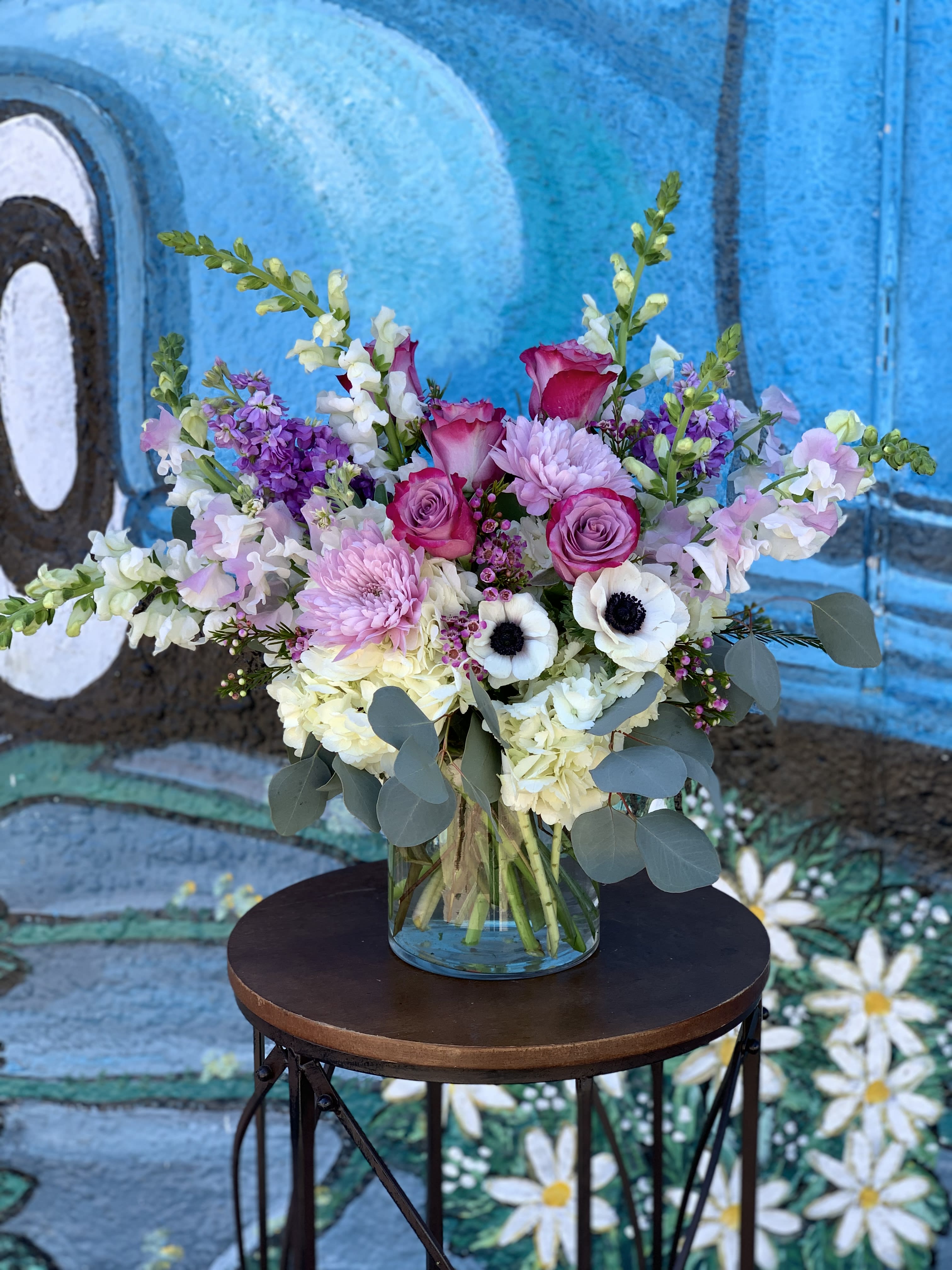 Pink &amp; Lavender Lush  - Seasonal pink, white and lavender flowers arranged in a vase. 