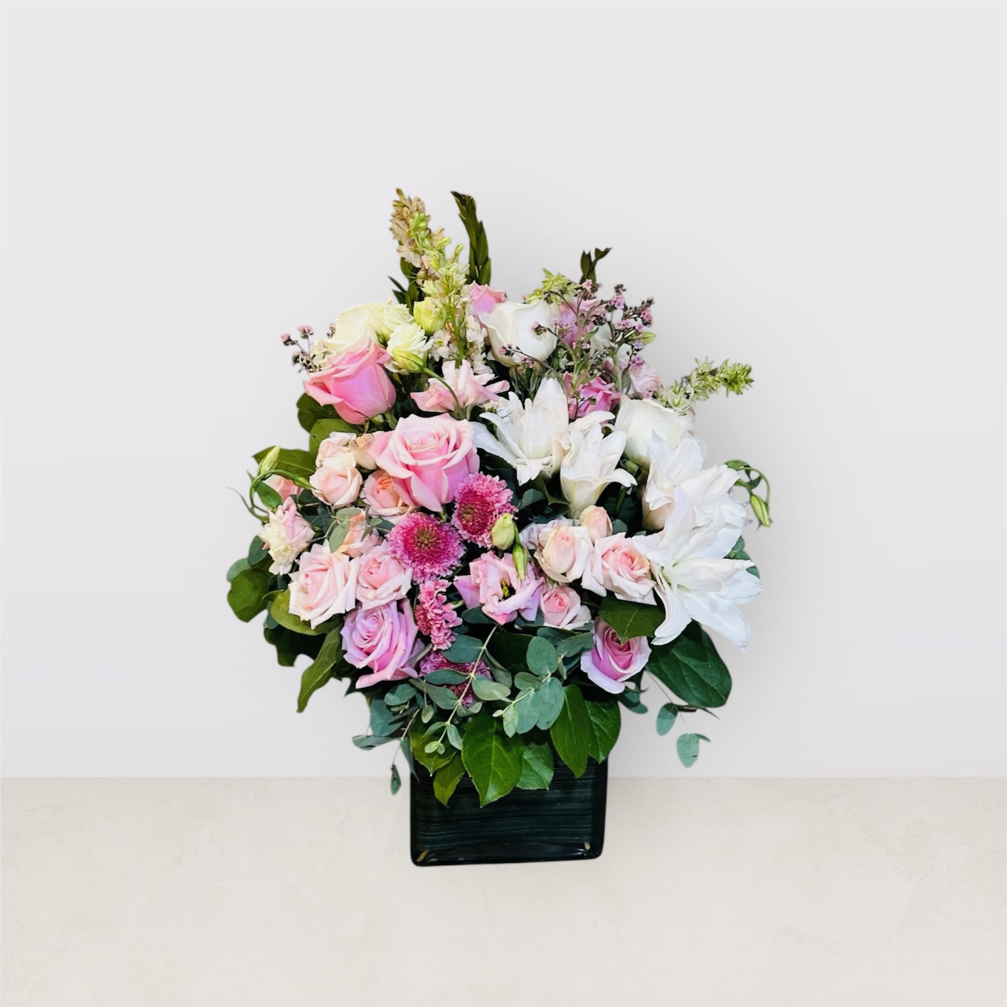Everlasting Love -  This luxurious display is ideal for special events or as a stunning gift to brighten someone's day. One sided arrangement 